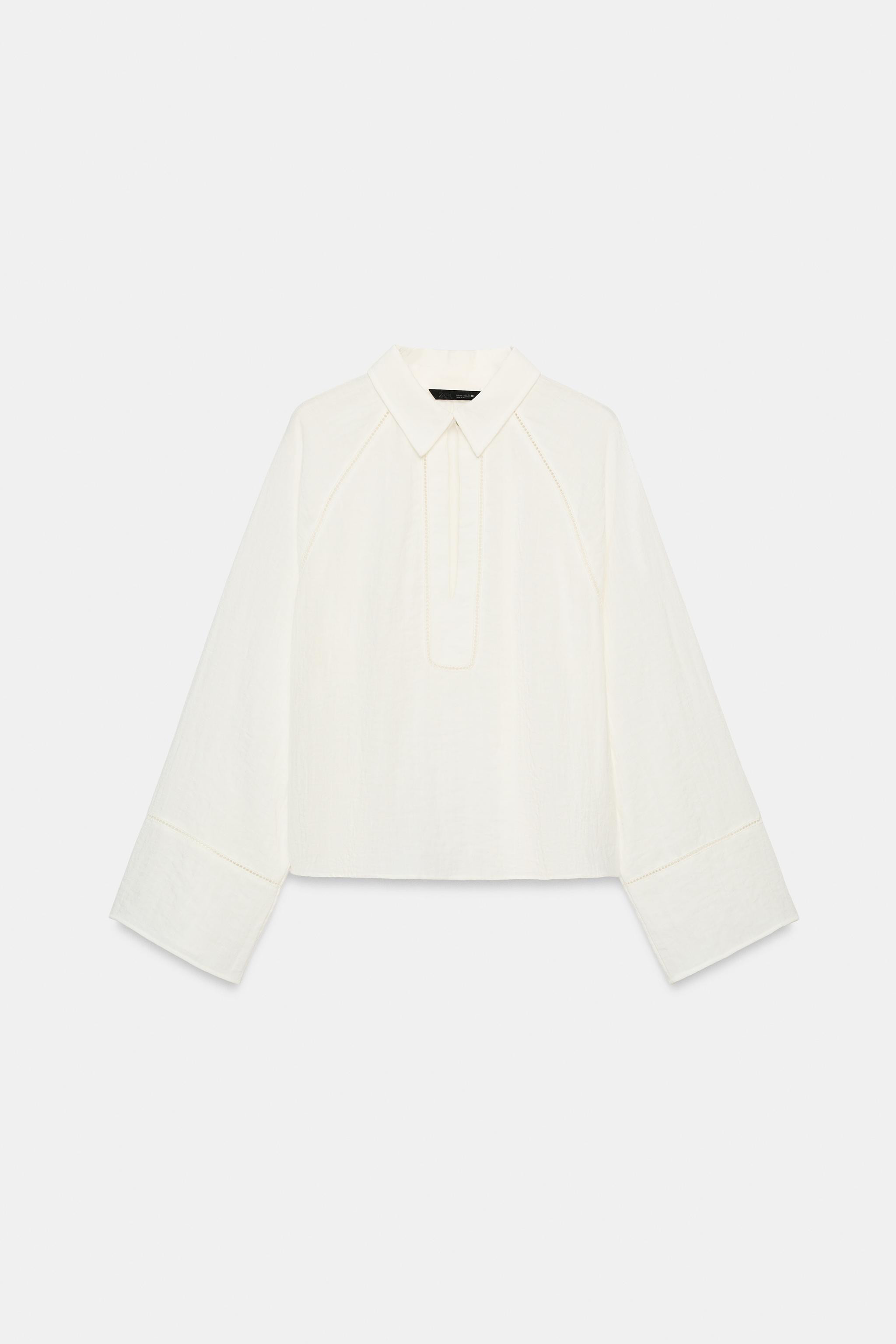 Model height: 180 cmShirt with a regular collar, V-neck and wide long sleeves. Matching lace trim... | Zara UK