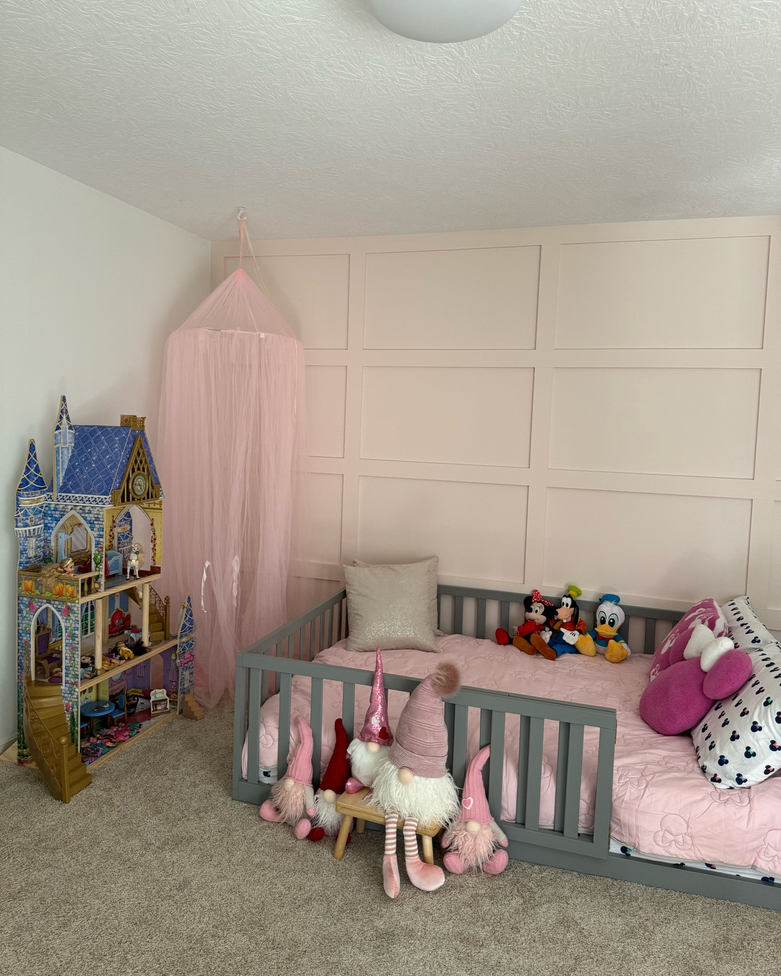 Kids bedroom. Montessori floor bed. Canopy. Girls room decor. Princess castle. Kids bedroom. Girl room decor. Toddler girl room. Girl room ideas. Board and batten accent wall. Minnie Mouse bedding. Disney room decor. Dollhouse. 

#LTKKids #LTKFamily #LTKHome