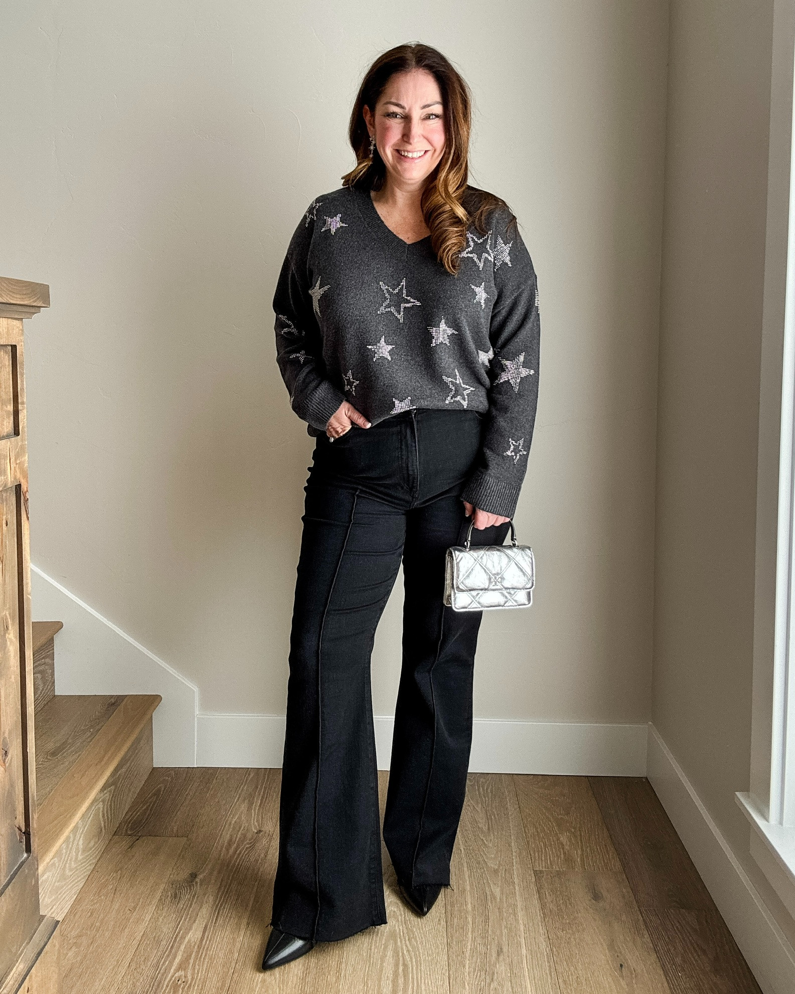 New Year's Eve outfit with star sweater and black flare jeans with front seam. Wearing large in sweater and 14R in jeans size up if in-between  

 #LTKHoliday #LTKSaleAlert #LTKMidsize