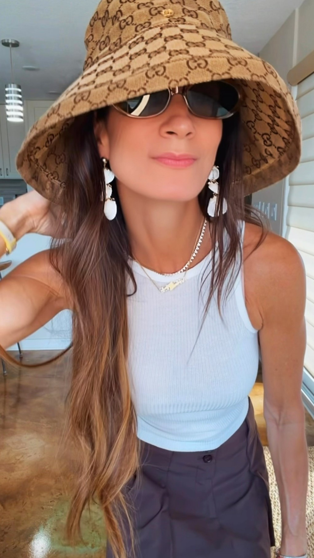 Sometimes the outfit is simple… and that’s exactly why the accessories deserve their moment. 🤍✨

A white tank. Easy draped skirt. Neutral everything.

Then you add a pair of statement earrings… and suddenly the whole look feels intentional.

These shell beauties instantly make even the most basic outfit feel vacation-ready, polished, and just a little more fun. That’s the magic of great accessories—they do all the heavy lifting so your outfit doesn’t have to.

Proof that you don’t need a new wardrobe… sometimes you just need better earrings. 😉🐚

#NicoleColeeStyle #SummerStyle #StatementEarrings #ResortStyle #AccessoryObsessed

#LTKdayinmylife #LTKgrwm #LTKootd