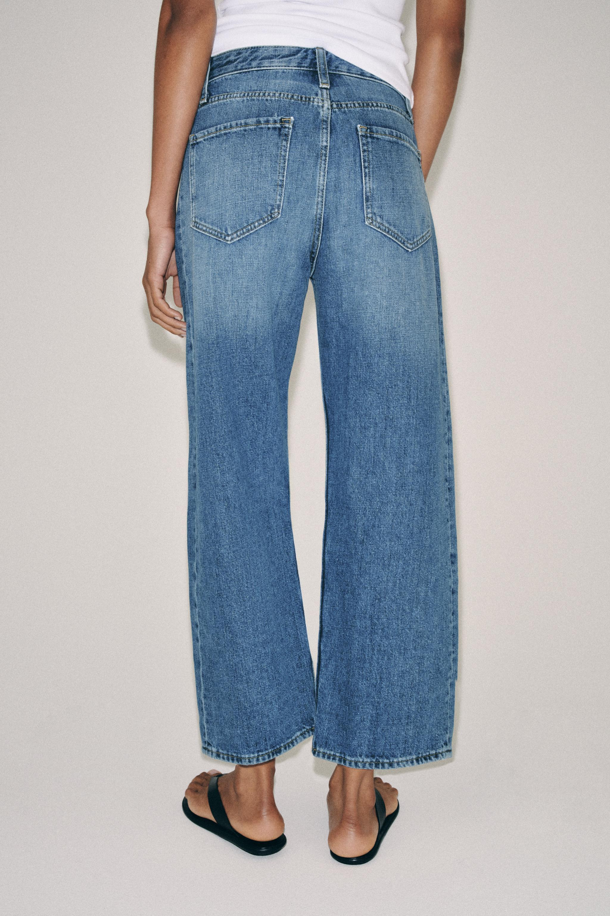 ZARA WOMAN COLLECTIONMid-waist jeans with belt loops. Five pockets. Washed effect. Front zip fly ... | Zara UK