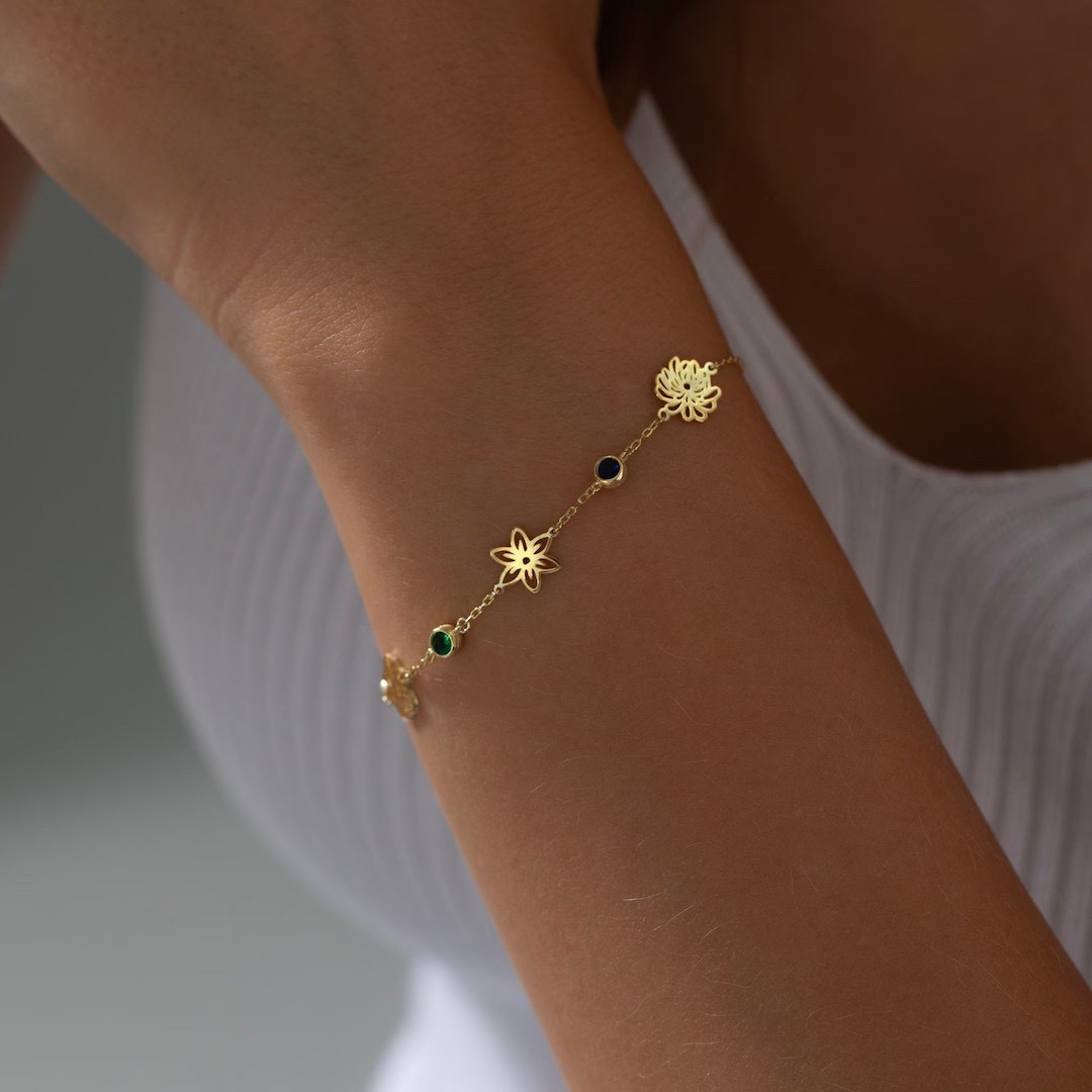 This personalized birth flower bracelet adds a sweet, meaningful touch to any jewelry collection with its delicate design and sparkling cubic zirconia accents. Handcrafted in your choice of rose gold, white gold, or yellow gold, it can be customized with a birth flower, initial, or birthstone to create a piece that feels truly personal. Whether you’re shopping for Christmas, a birthday, or a heartfelt everyday gift, this dainty bracelet is a beautiful way to celebrate the women you love. #EtsyFinds #LTKGiftGuide #BirthFlowerBracelet #PersonalizedJewelry #GiftForHer #MinimalistStyle #HolidayGifts

#LTKHoliday #LTKGiftGuide #LTKFindsUnder50