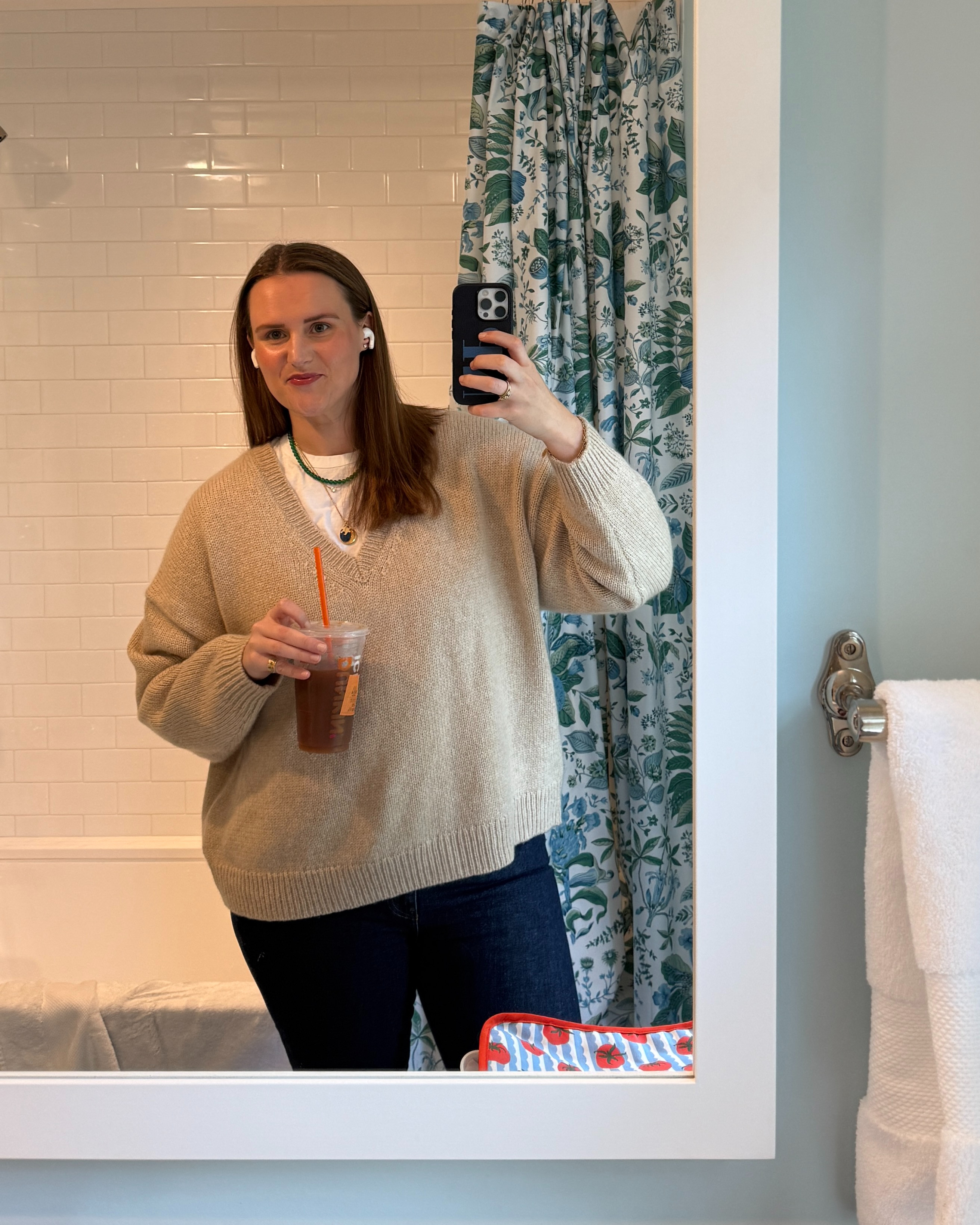 A cozy and classic everyday outfit of a tan v-neck cashmere sweater, a white t-shirt and dark wash denim jeans. #classic #preppy #midsize #xl 

 