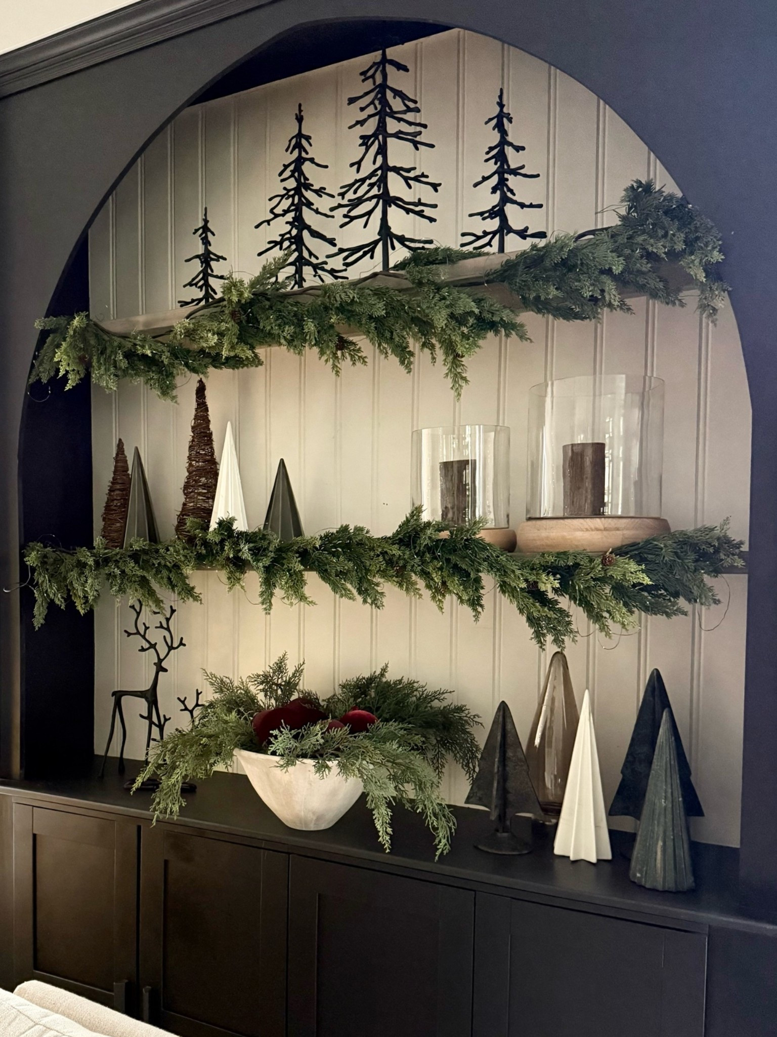 Holiday shelf styling. 
My pb trees and reindeer are back this year. I love this moody organic look✨
Holiday home 
Christmas 2026

#LTKhome