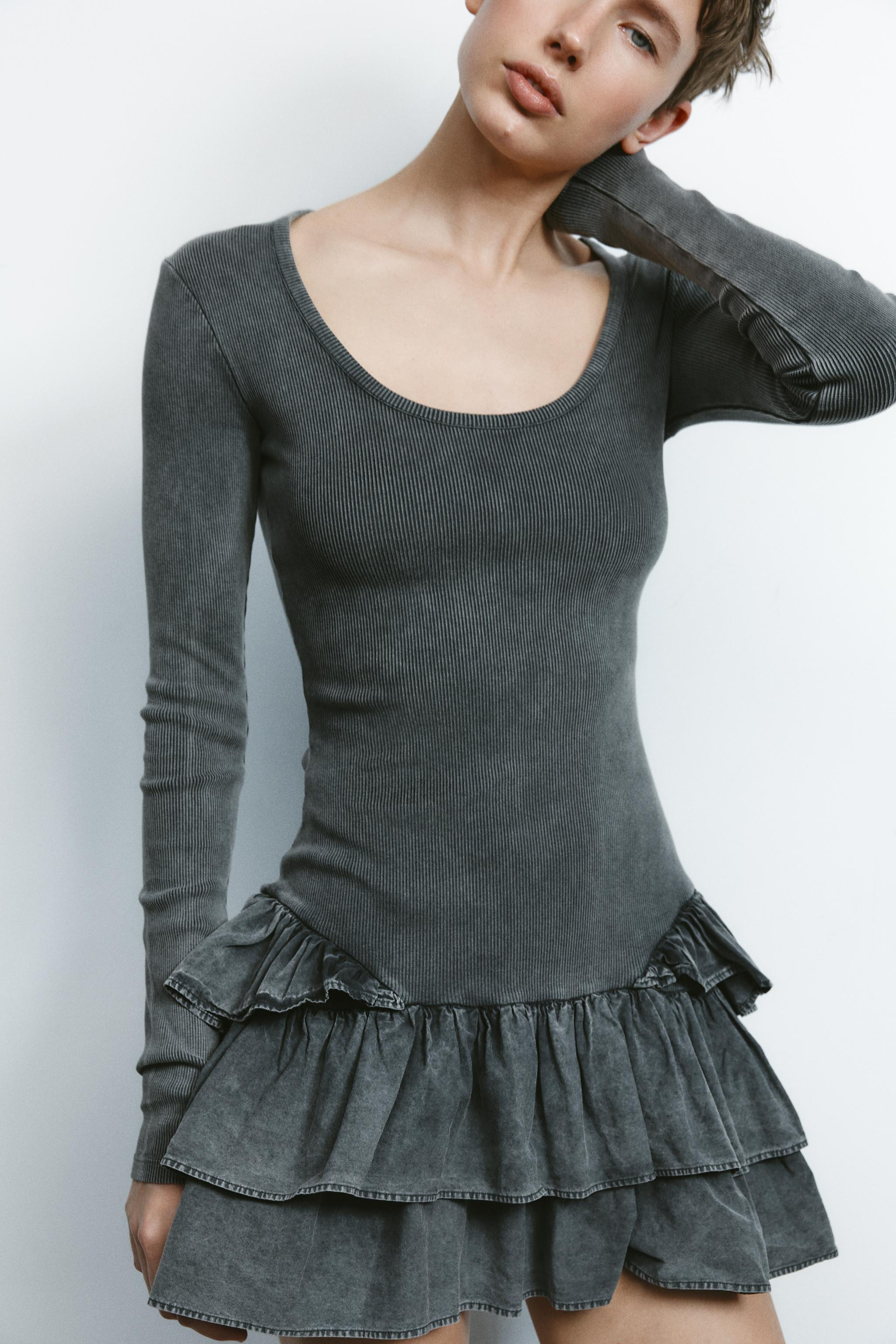 Short washed-effect cotton dress. Round neck and long sleeves. Ruffled hem with contrasting fabri... | Zara US