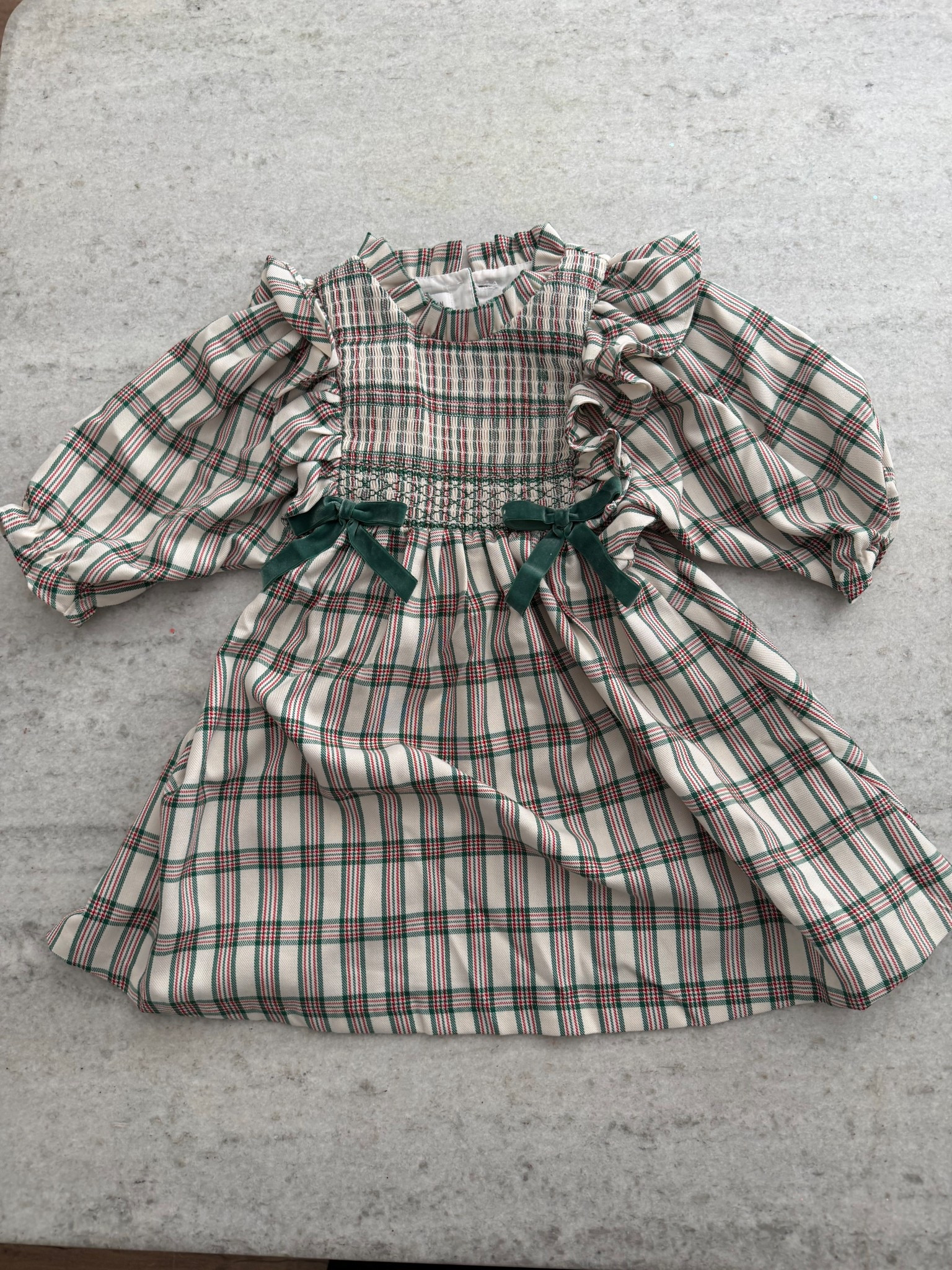 Classic Christmas plaid perfection 🎀 This smocked dress with ruffled sleeves and velvet bows is made for holiday photos, Santa visits, and matching sister looks. It’s timeless, soft, and such a sweet Christmas outfit.

#ltkholidaystyle #ltkfamily #kidsfashion #christmasdress #ltkfinds

#LTKGiftGuide #LTKHoliday #LTKKids