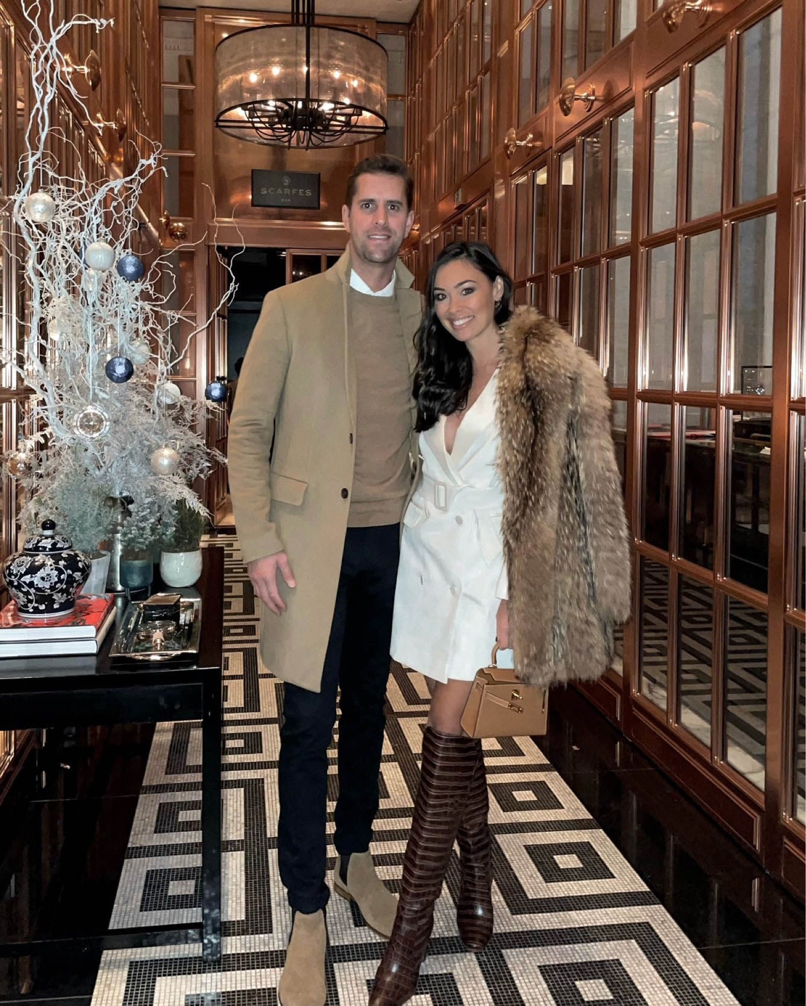 Kat Jamieson of With Love From Kat wears a date night look. White blazer dress, faux fur coat, knee high boots, winter style.

#LTKshoecrush #LTKSeasonal #LTKstyletip