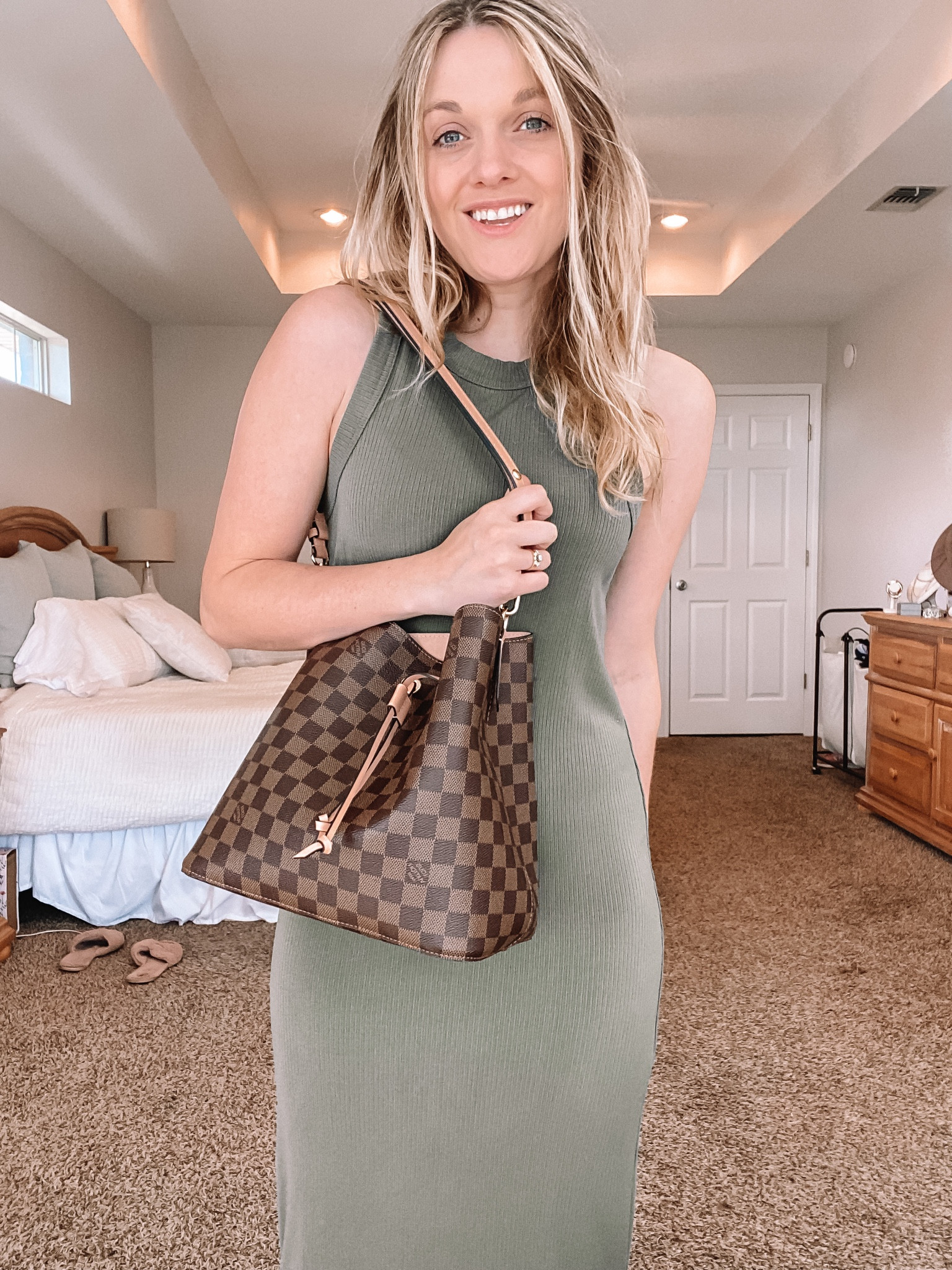 Outfit of the day perfect for warmer climate areas that are wanting to look chic for fall! This very autumn style sweater tank dress is perfect for anyone who lives in a warmer area and the autumn colors of neutral tones, greens, and reds make it perfect for the season! Style with ankle booties or some neutral color mules. Linking similar dresses from Banana republic and Abercrombie! Dress featured is the Banana Republic tank dress! 

#LTKSeasonal #LTKsalealert #LTKworkwear
