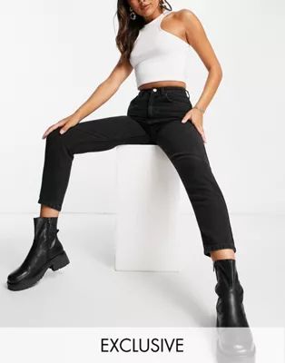 Reclaimed Vintage The '89 slim tapered leg jeans in black | ASOS (Global)