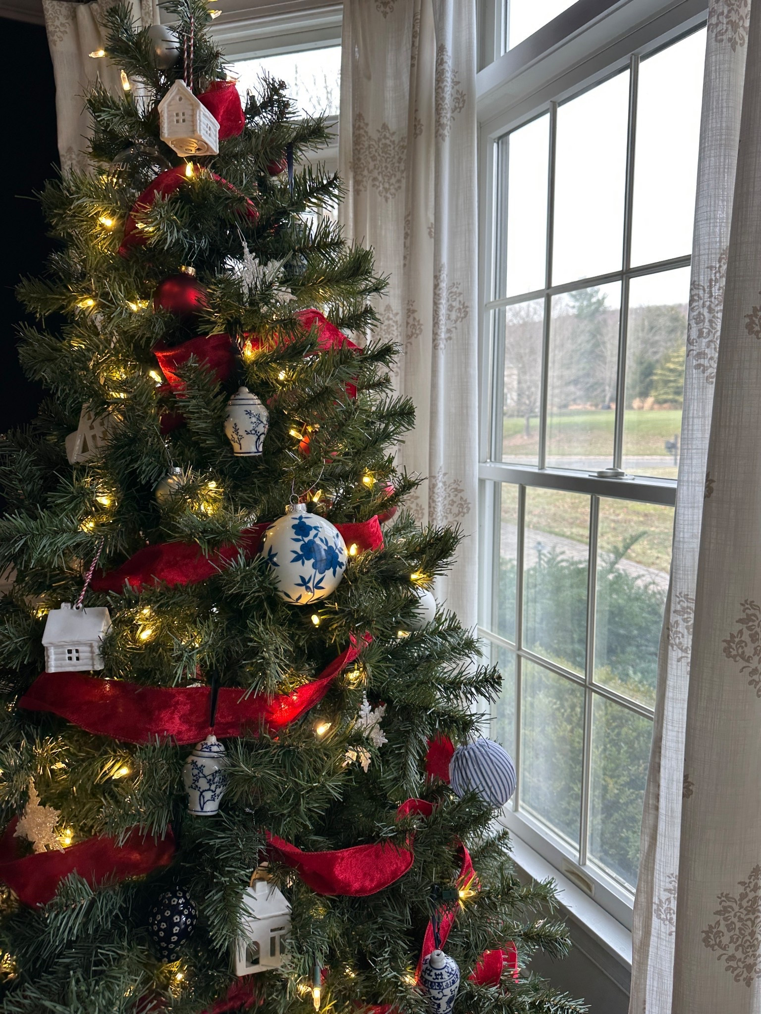  Traditional Christmas tree with blue and white decorations. 

#LTKSeasonal #LTKHoliday #LTKHome