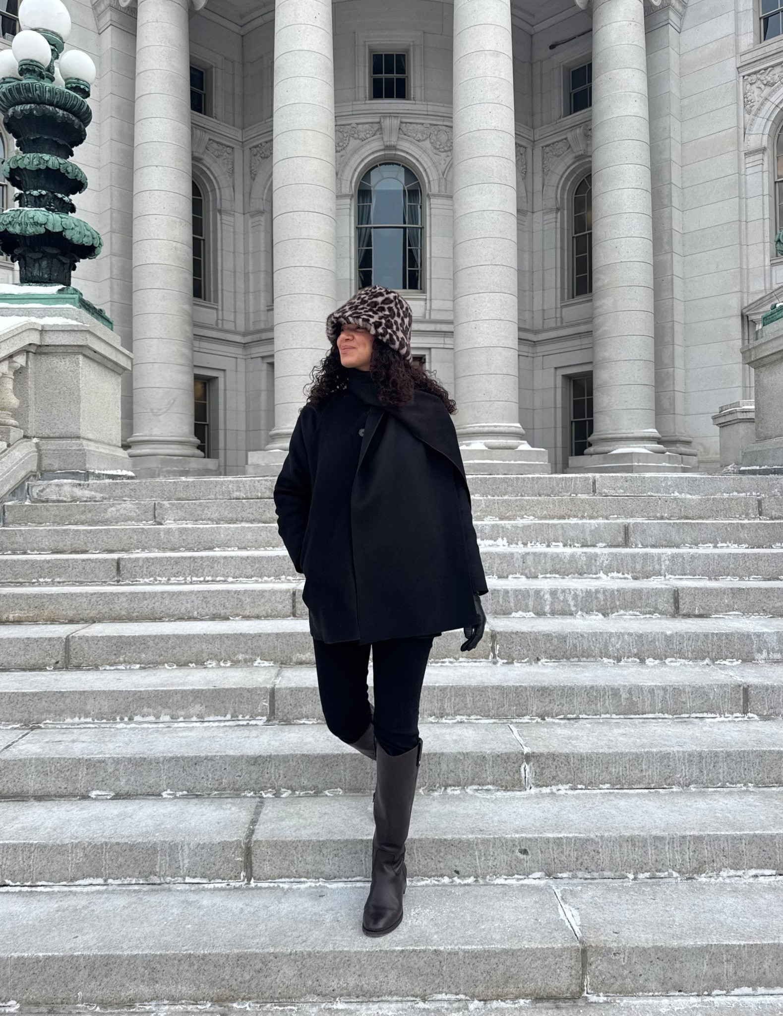 winter outfit idea: scarf coat, fuzzy faux fur leopard print bucket hat, leather gloves, jeans, riding boots 

#LTKSeasonal #LTKootd