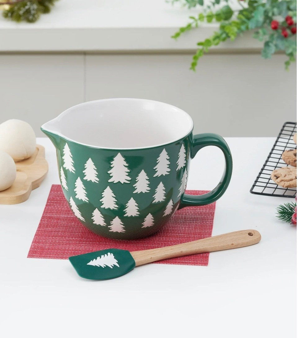 The cheerfully designed Holiday Time 2-Piece Tree Glazed Stoneware Batter Bowl & Spatula Set is magnificent for preparing tasty baked delectables throughout the holiday season. This batter bowl and spatula set includes one 2-quarts mixing bowl with a handle and one wood-and-rubber spatula. Constructed of durable 100% stoneware with a glazed finish, the bowl is dishwasher and microwave safe.

#LTKSeasonal #LTKHoliday #LTKHome