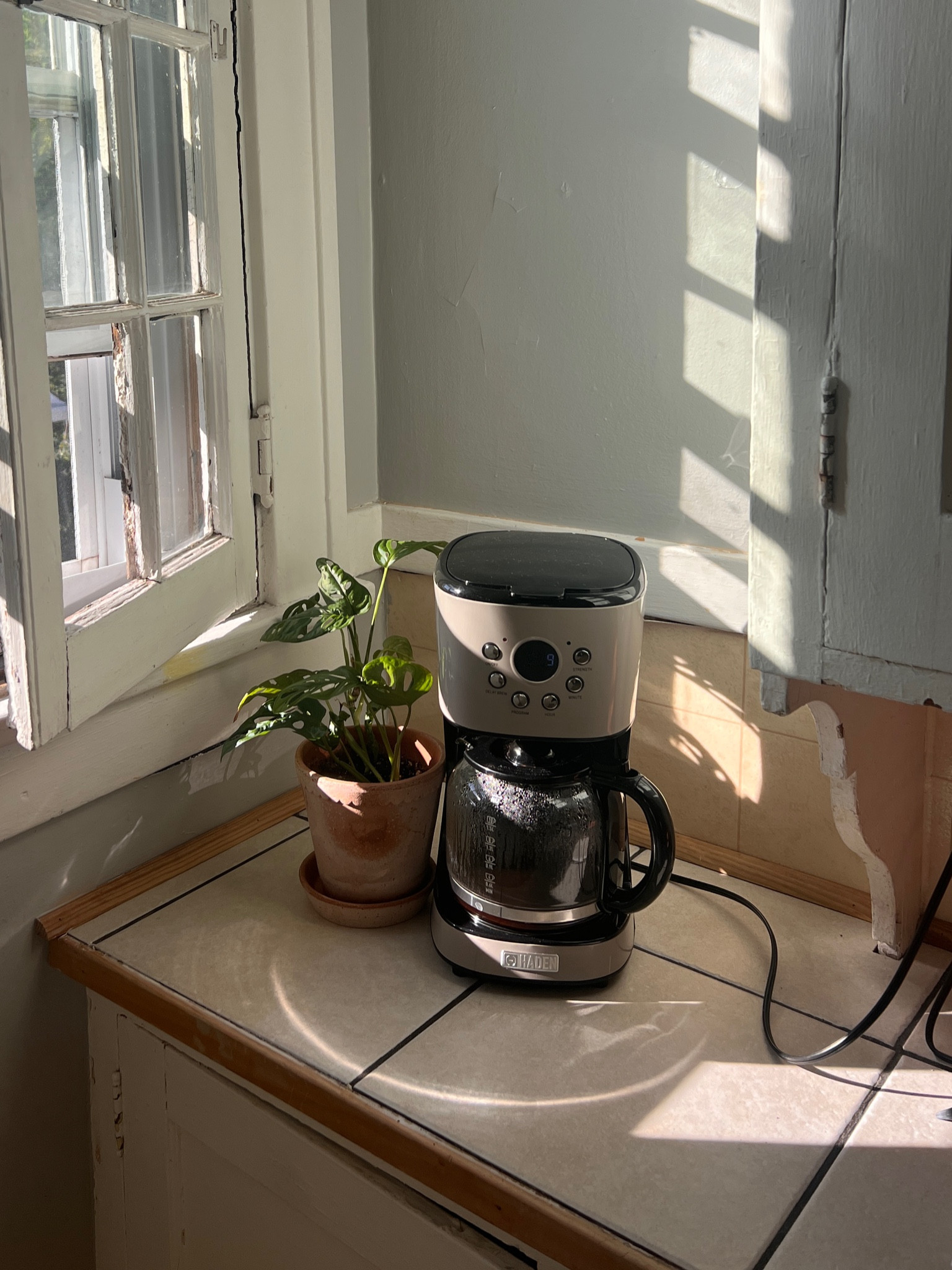a pretty corner in a very in-progress kitchen. Love this little coffee maker, cute and functional! 

#LTKHome #LTKFindsUnder100