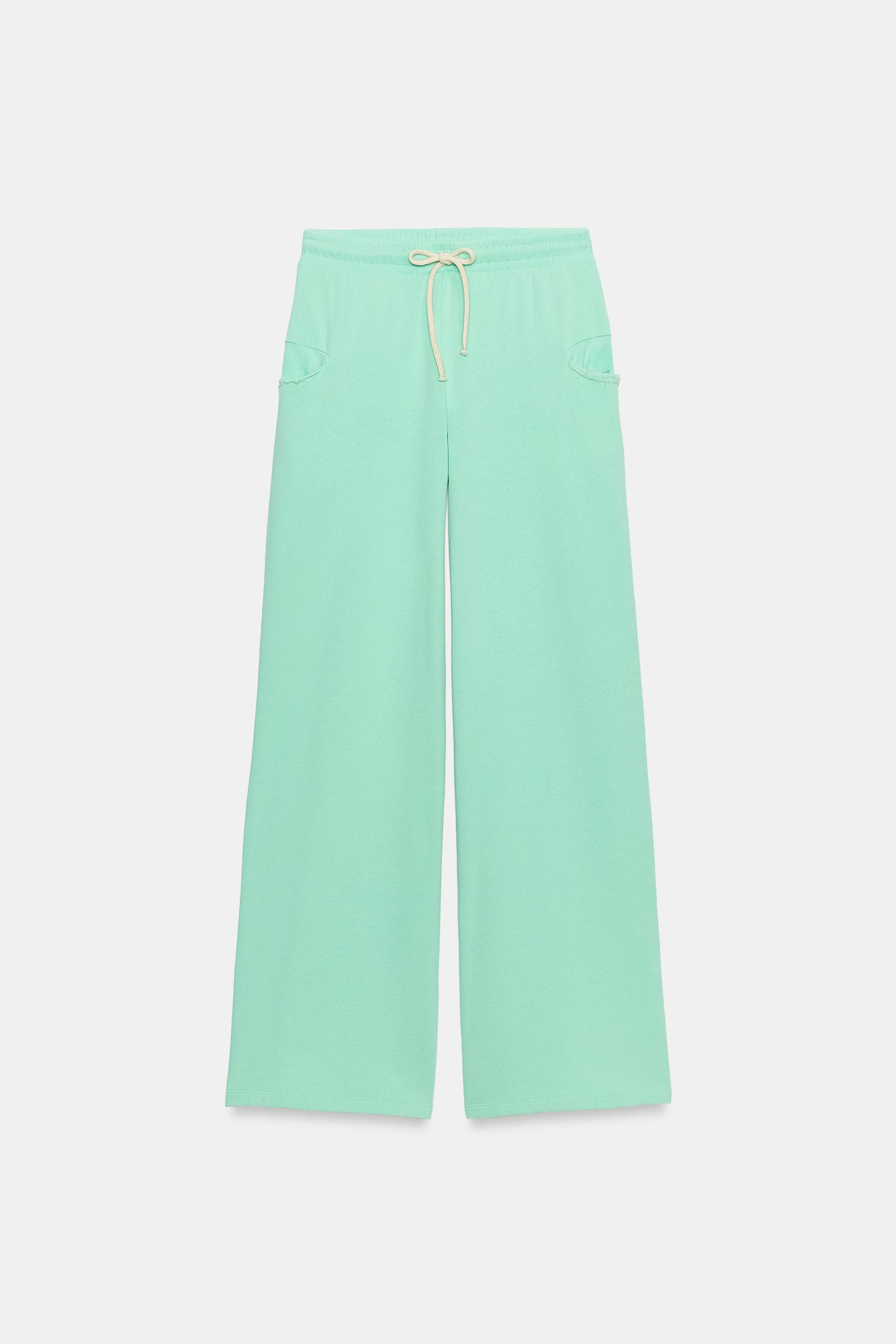 Trousers crafted from a cotton-blend yarn. Mid-waist design featuring an adjustable elasticated w... | Zara UK