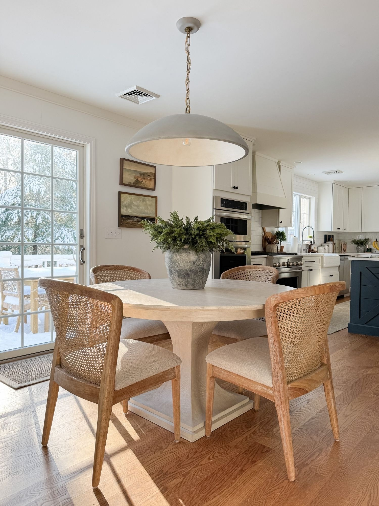 Light filled dining space! A bright dining area styled with warm wood tones, woven chairs, and soft neutrals for a relaxed coastal gathering space. 

Coastal dining room, neutral dining space, woven chairs, cape cod home, warm wood tones, casual dining, timeless home decor, coastal interiors, Sherri Calnan Home

#LTKHome #LTKSeasonal