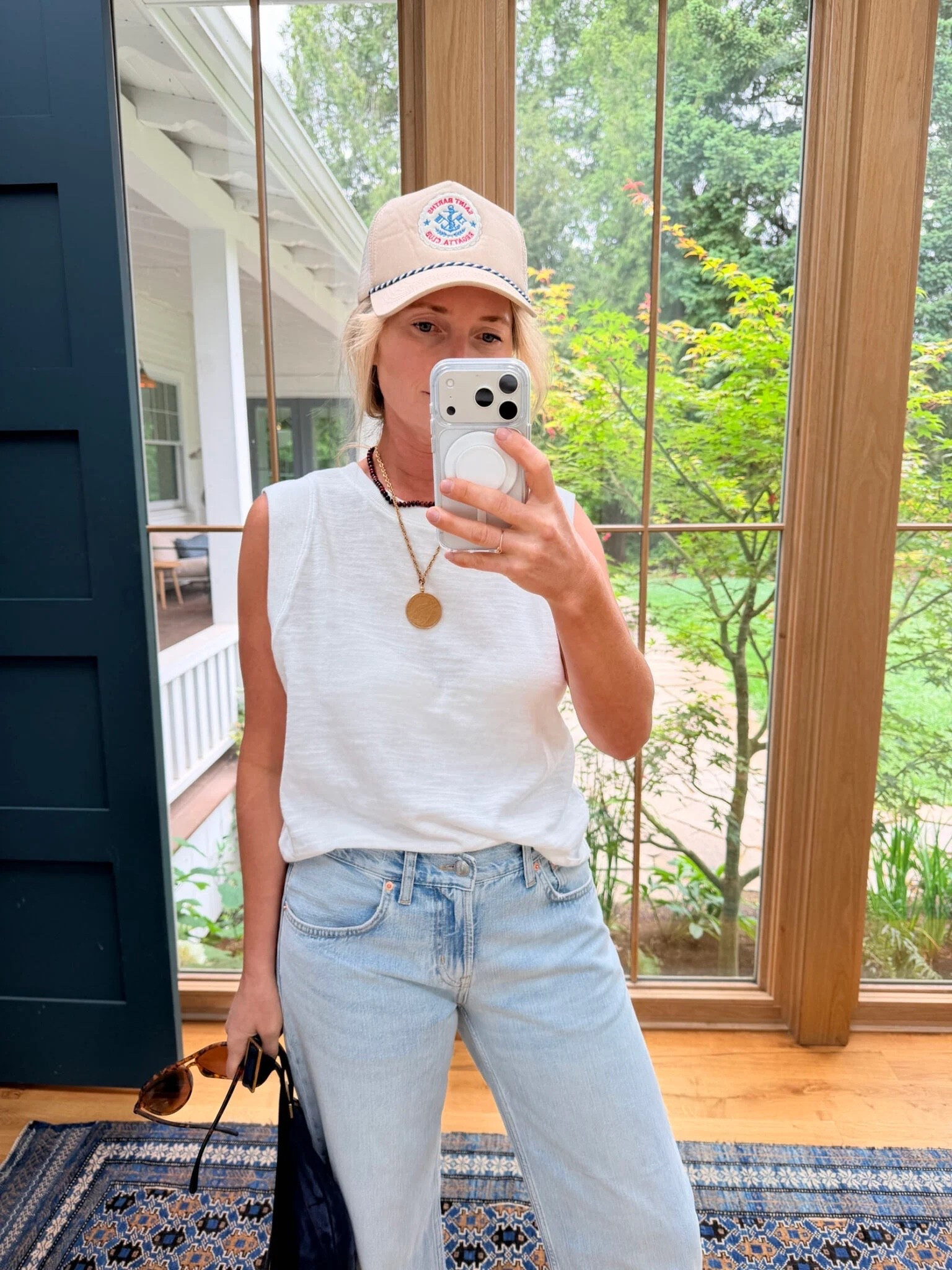 This tank is such a high quality fabric and the sleeve detail is so flattering!! Wearing a small. Also sooo into these new jeans. Linked a similar hat:)