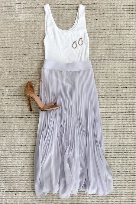 Spring and summer outfit with light purple midi skirt paired with white tank and heels for a chic look. Would look pretty dressed down in sandals or sneakers, too. I love how whimsical it looks for this season 

#LTKstyletip #LTKSeasonal