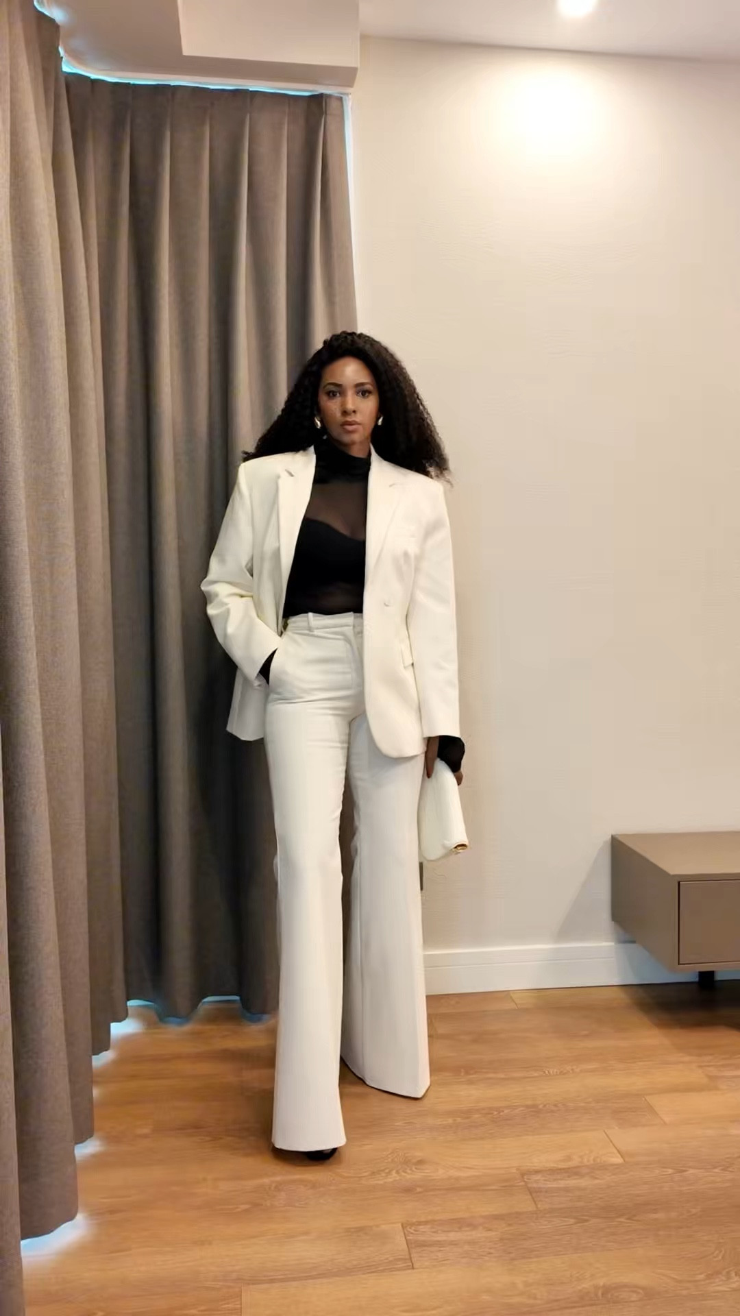 1. A crisp white suit paired with a sleek black top—effortlessly powerful and refined. The perfect balance of structured tailoring and modern elegance.

#LTKspring #LTKstyletip