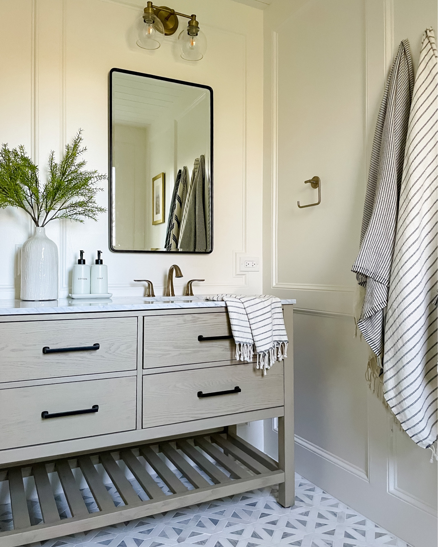 Neutral bathroom design. Recessed medicine cabinet mirror. Bathroom mirror. Bathroom light. Sconces. Turkish towels. Marble tile. Mosaic. Drawer pulls. Soap and lotion dispenser  

#LTKhome