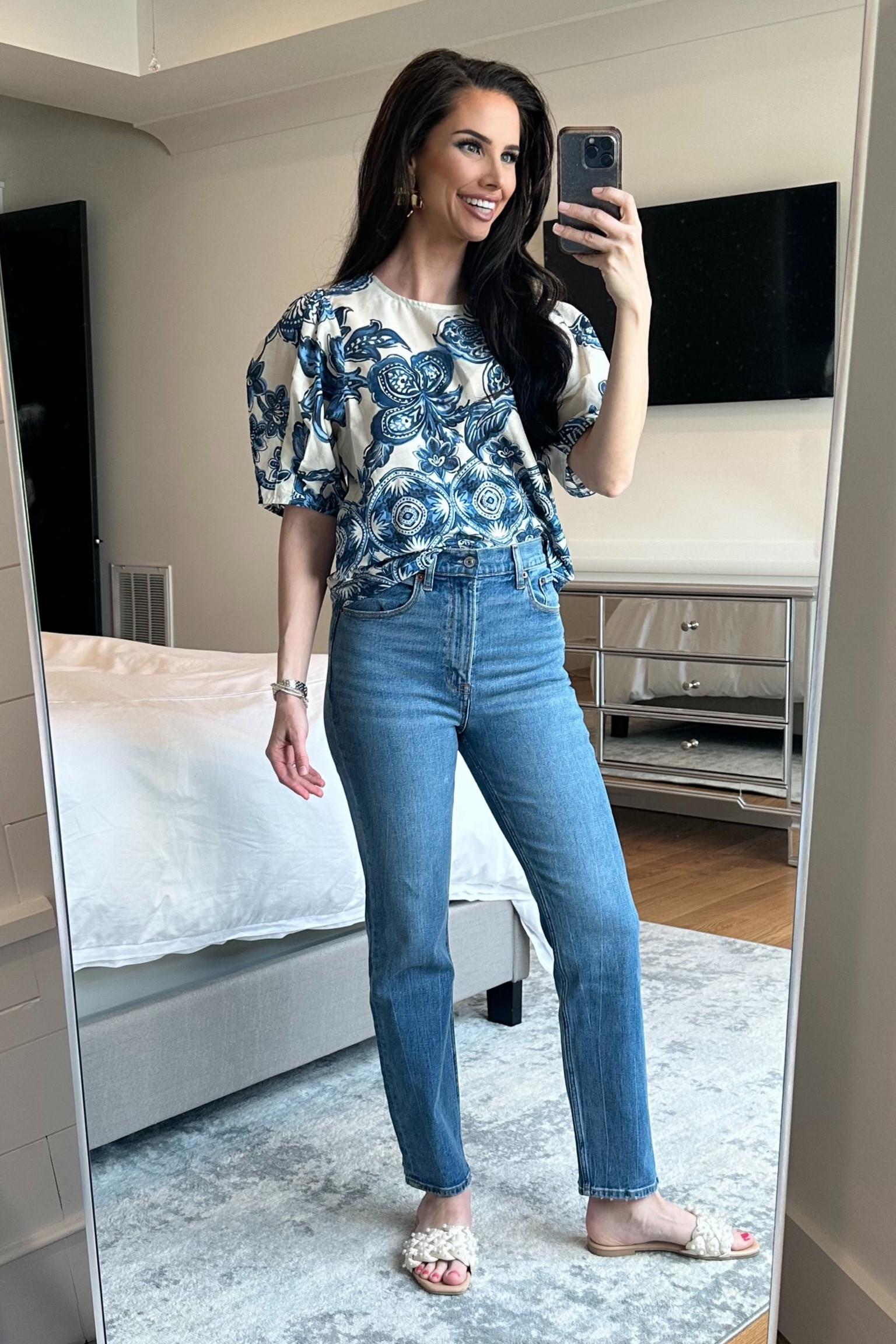 Spring casual outfit. White and blue puff sleeve top with Abercrombie ultra high rise ankle straight jeans and pearl slides. I’m wearing size 26 long in the jeans. 

#LTKstyletip #LTKshoecrush