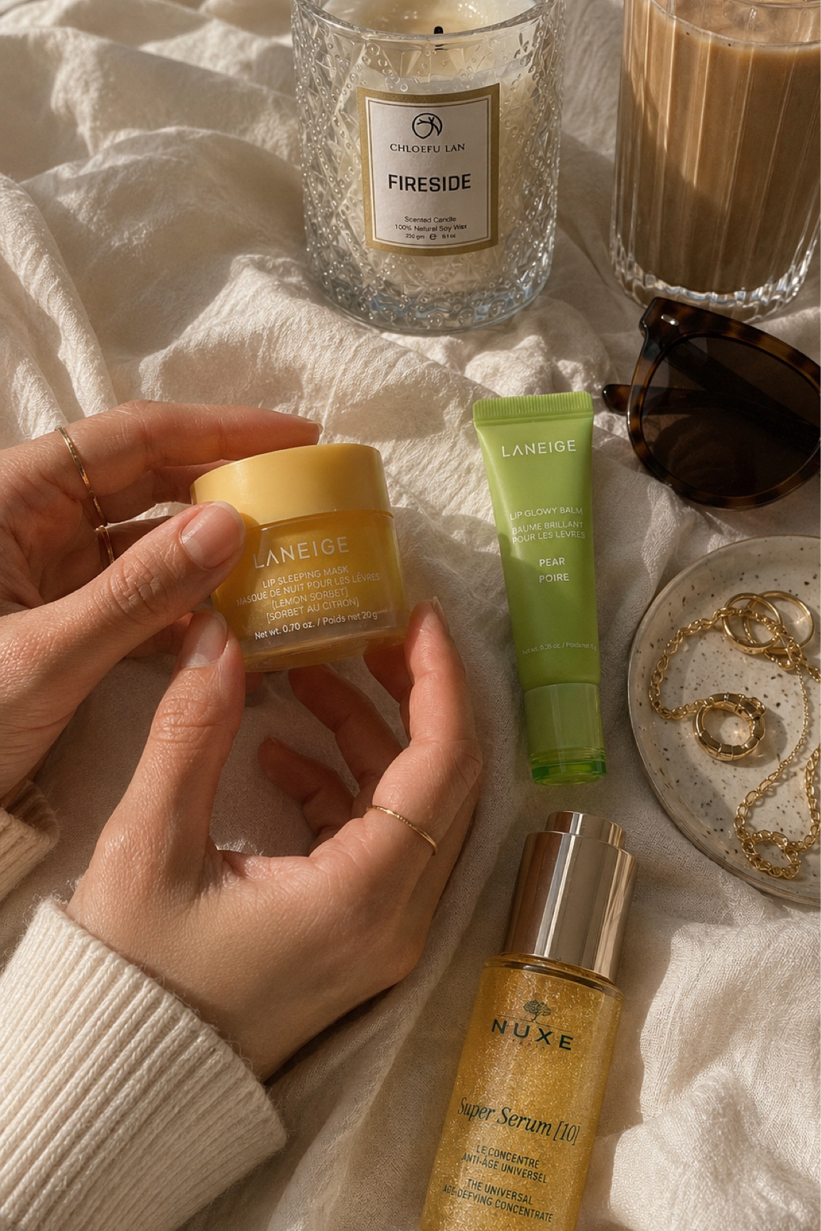 Soft luxury favorites lately ☁️✨

These are the products currently living on my nightstand + in my daily routine:
• Laneige Lip Sleeping Mask
• Laneige Lip Glowy Balm
• NUXE Super Serum
• Cozy candle moments
• Gold jewelry staples
• Morning iced coffee always ☕️

Everything is linked in my shop 🤍

#ltkbeauty #ltkhome #amazonfinds #beautyroutine #cozyaesthetic #laneige #quietluxury #everydayessentials

#LTKdayinmylife #LTKgrwm #LTKmorningroutine