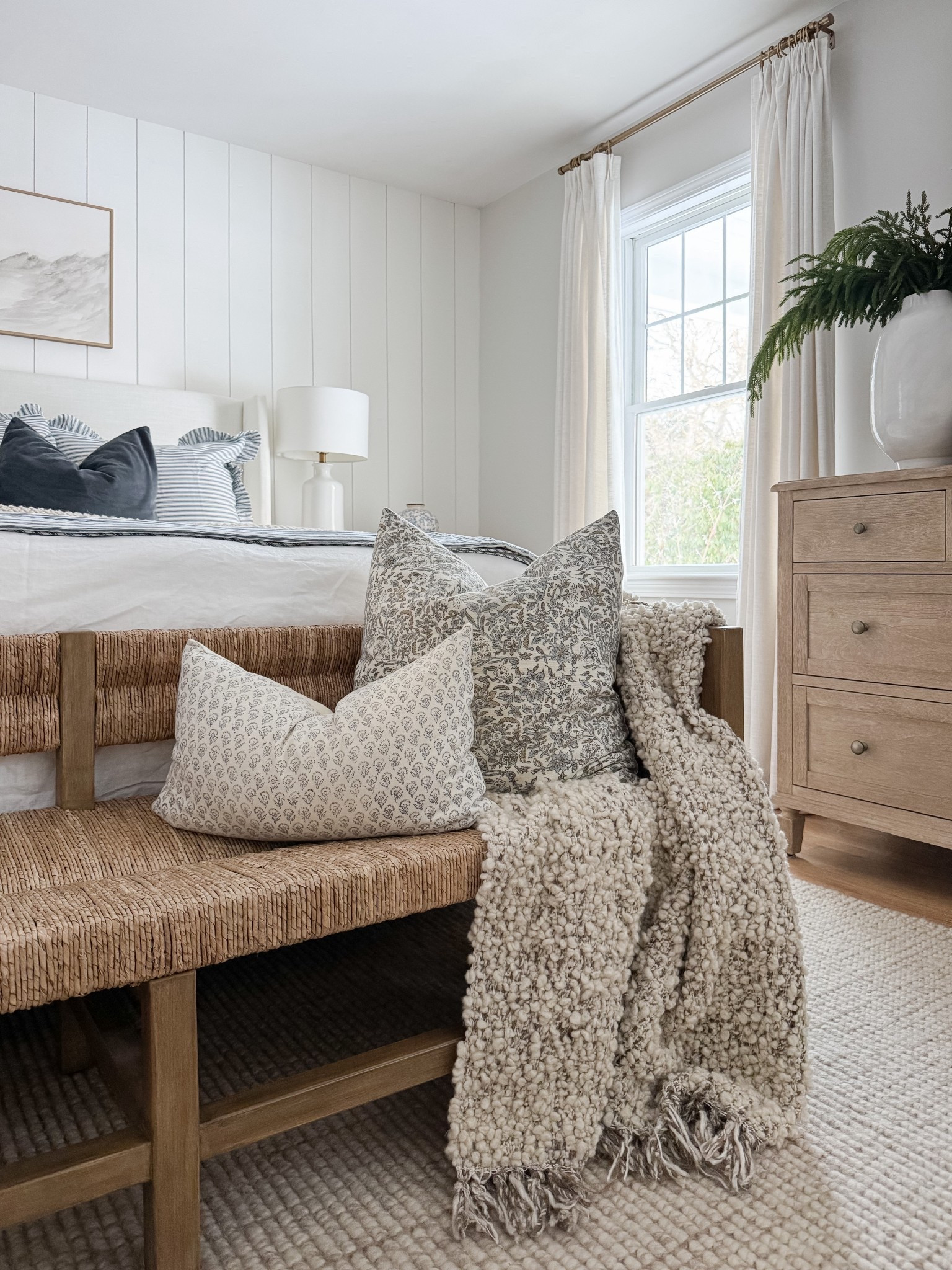 Layered bedding, warm wood tones, and soft textures make this coastal bedroom feel calm and complete. coastal bedroom decor, neutral bedroom, upholstered bed, woven bench, coastal home style, serene bedroom, timeless interiors, bedroom inspiration, sherricalnanhome

#LTKFindsUnder50 #LTKHome
