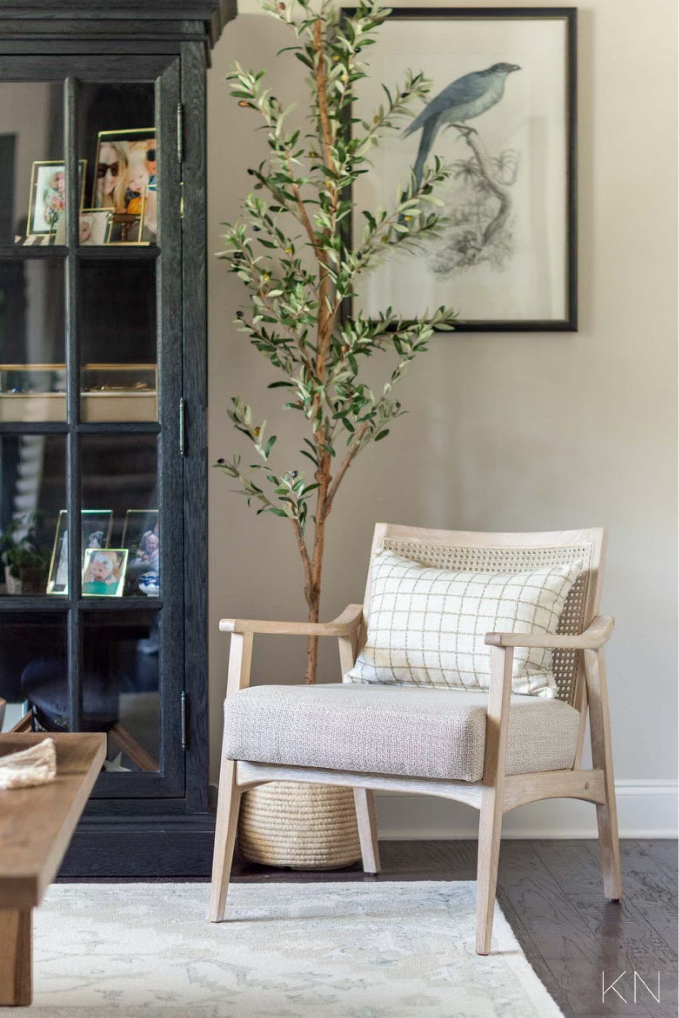 This little corner of my conversation room features this cane back accent chair, faux olive tree and bird print that comes in a pair of two. There’s also a peel of my black glass front curio cabinet that holds family mementos and memories. home decor living room decor seating Edgecomb gray paint neutral decor styling

#LTKsalealert #LTKhome #LTKstyletip