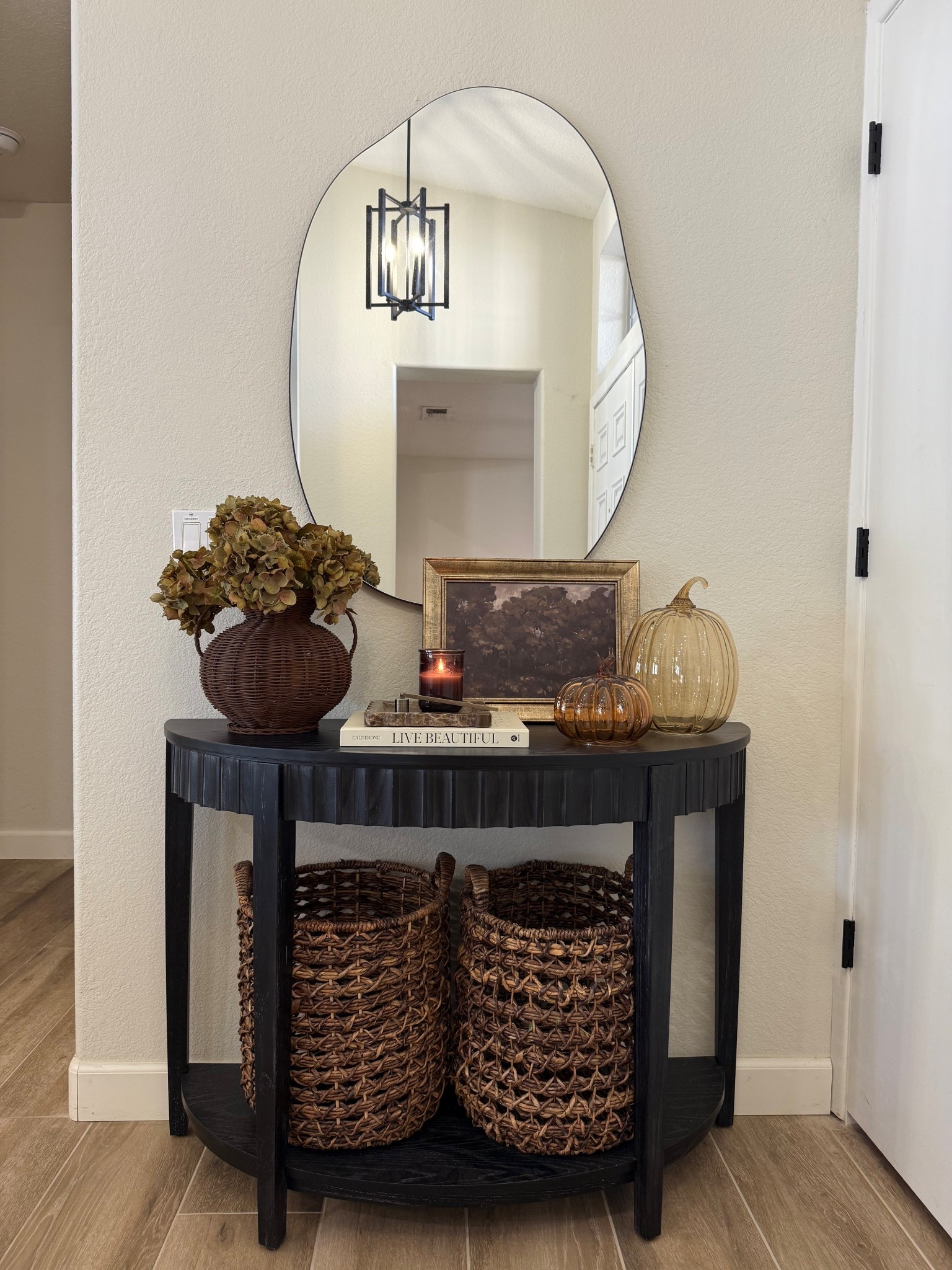Neutral + Moody Fall Entryway Decor 🍂
Bringing in the warm, rich tones of autumn with dried hydrangea stems (set of 6 shown here) and neutral glass pumpkins for an early fall look.
I styled my entry table with layered moody art, natural textures, and cozy accents you can easily recreate in your own space. Everything is linked so you can shop the exact pieces or similar finds!

Shop the look:
• Dried hydrangea stems – set of 6
• Neutral glass pumpkins
• Moody art print
• Rustic wood entry table

Fall entryway decor, neutral fall decor, moody fall home, entry table styling, glass pumpkins, dried floral stems, fall home accents


#LTKFindsUnder50 #LTKHome #LTKSeasonal