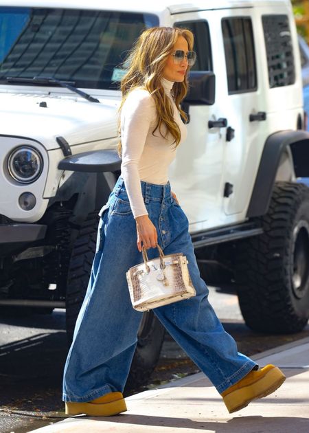 Shop Jennifer Lopez oversized baggy button front flare jeans, square frame sunglasses, cashmere ultralight high neck top platform sheer min boots #JenniferLopez #CelebrityStyle

#LTKstyletip