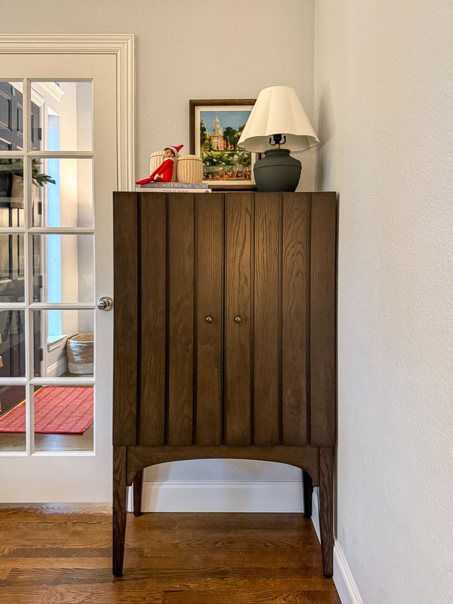 This elevated storage cabinet is on sale right now! It is a beautiful catch all piece that holds so much! I swapped out the knobs. 

#LTKSaleAlert #LTKHome