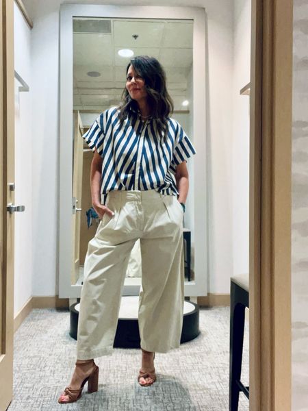 this stripe top has already sold out in store! it’s so good! runs big so go down one or wear loose like me! i’m wearing these pants loose as well but take your regular size otherwise. 

#LTKworkwear #LTKFestival #LTKtravel