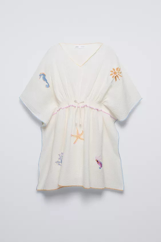 V-neck kaftan with short sleeves. Elasticized waist with ruffle and bow appliqué. Front embroide... | Zara US