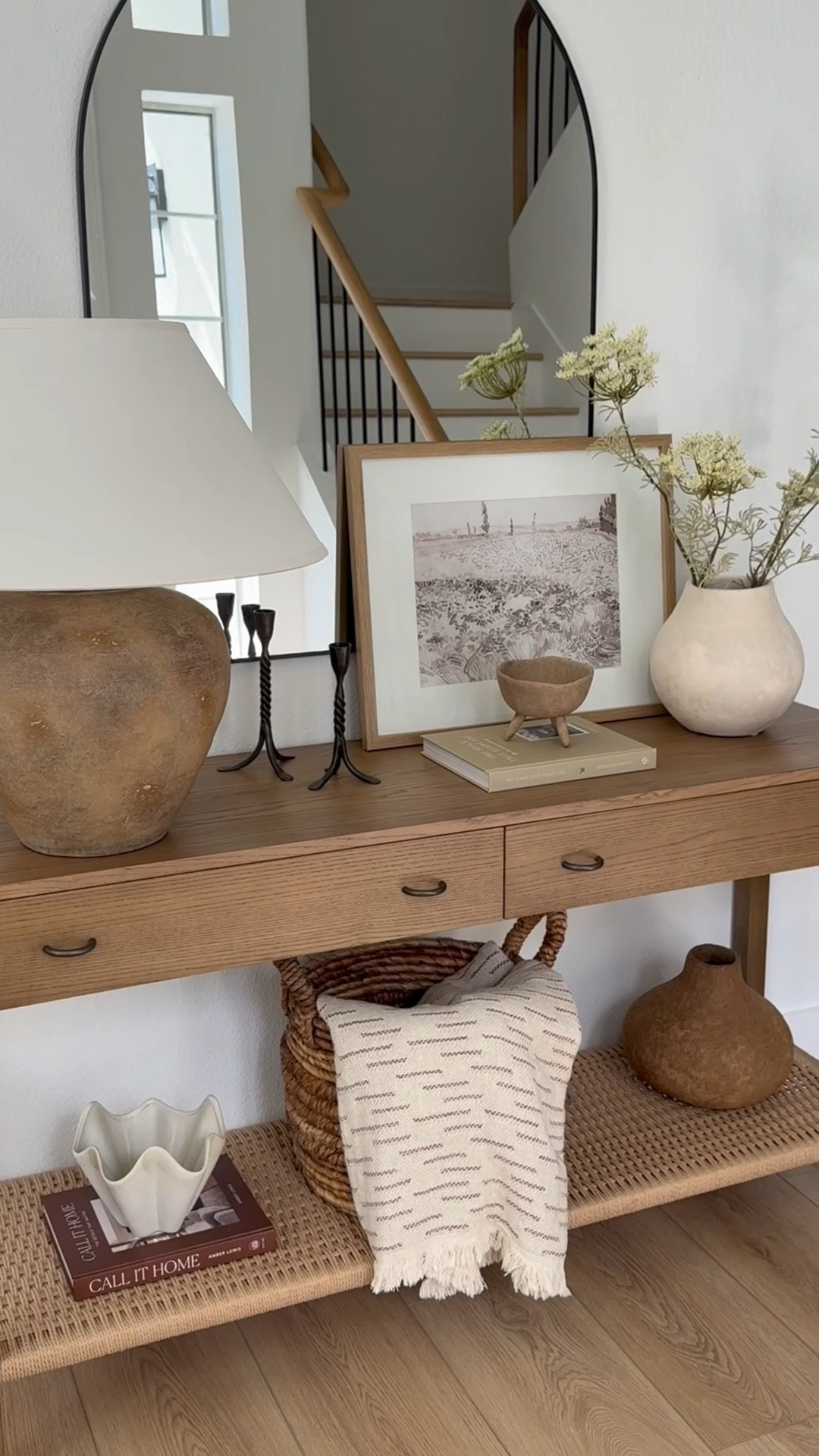 Entryway styling! 

This new console table check all the boxes: warm wood tone, woven texture, storage, sleek and organic modern design.

#LTKHome #LTKU #LTKStyleTip