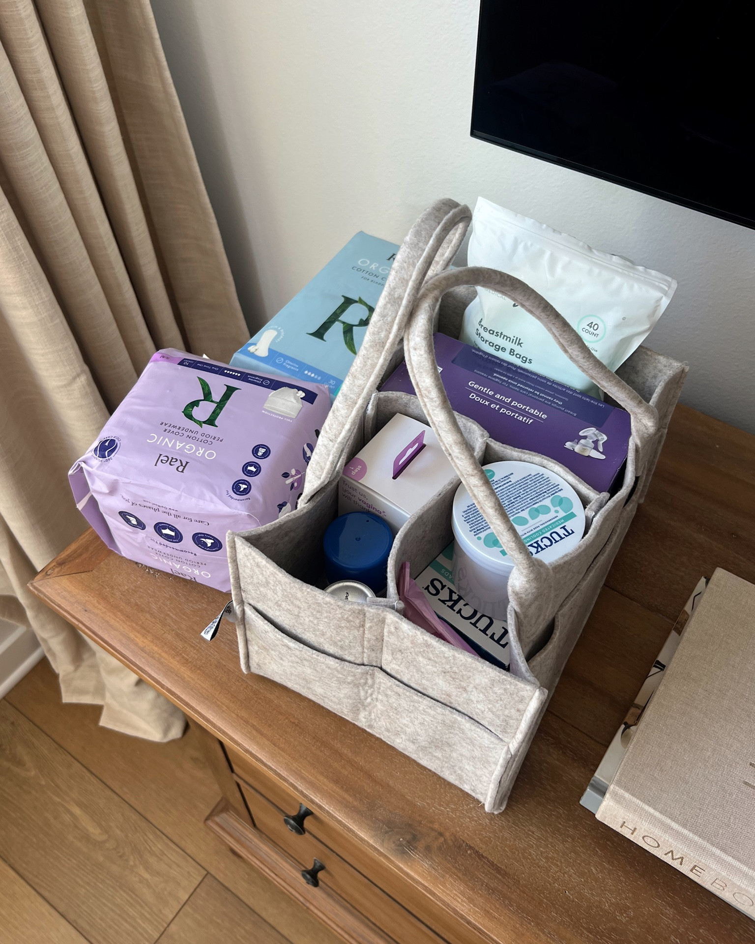 Postpartum carry around container to easily have things on hand at home for healing after baby!! Disposable underwear + cooling pads and wipes + peri bottle for cleaning when going to the bathroom + some pumping faves  

#LTKbaby #LTKfamily