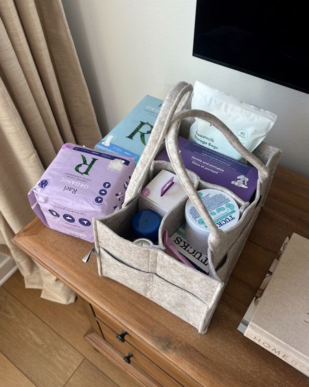 Postpartum carry around container to easily have things on hand at home for healing after baby!! Disposable underwear + cooling pads and wipes + peri bottle for cleaning when going to the bathroom + some pumping faves  

#LTKbaby #LTKfamily