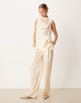 ASOS DESIGN high neck asymmetric satin top & tailored straight leg satin trouser co-ord	in ivory | ASOS (Global)