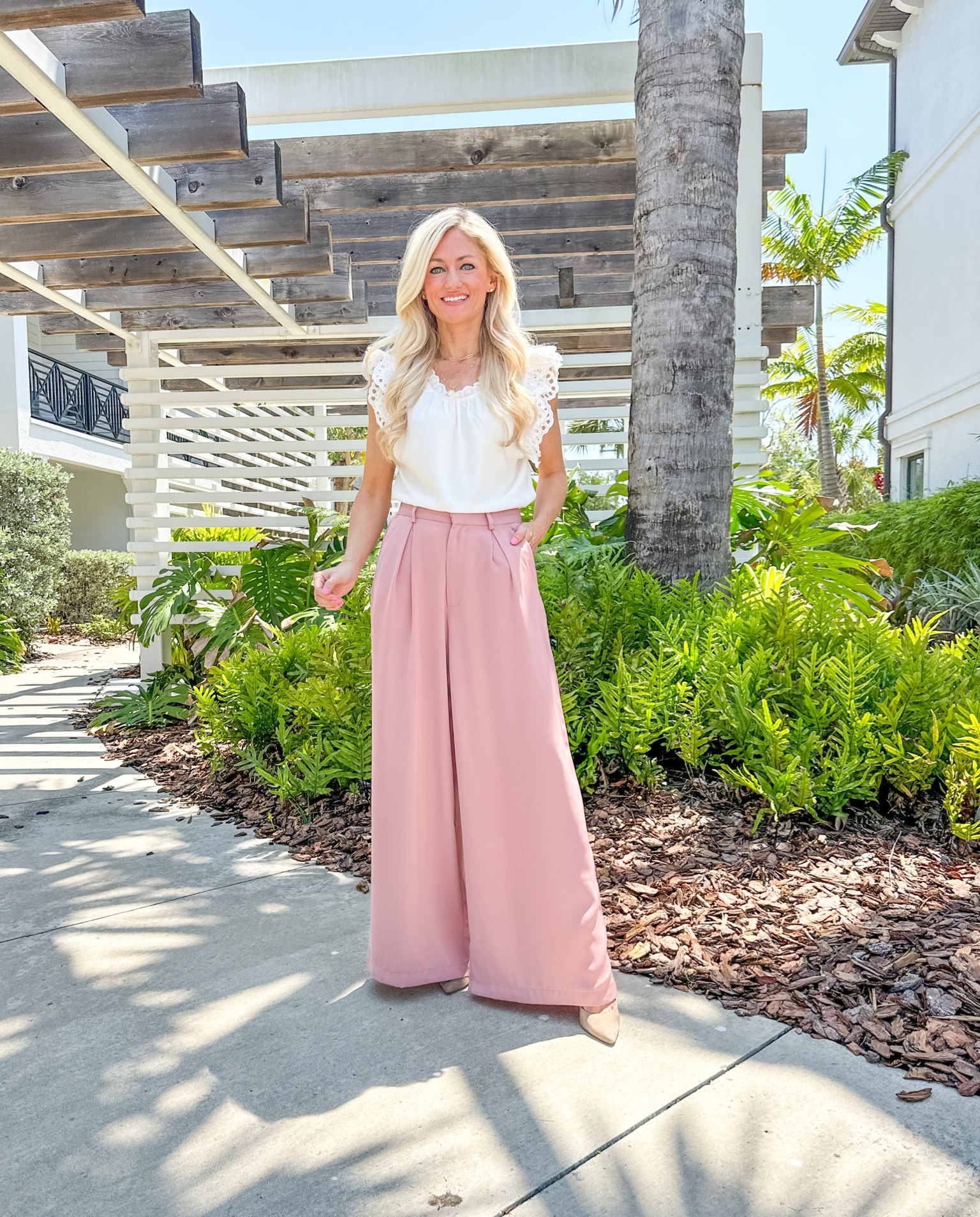 Spring/Summer Workwear outfit idea! Blouse has eyelet detail in the sleeve and ruffle detail around the neck. Top is lined. I’m wearing XXS and I would recommend sizing down. Use code JSTRONG10 for discount. Wide leg pants I’m wearing XS and the shade is rose tan. 

#LTKunder100 #LTKworkwear #LTKFind