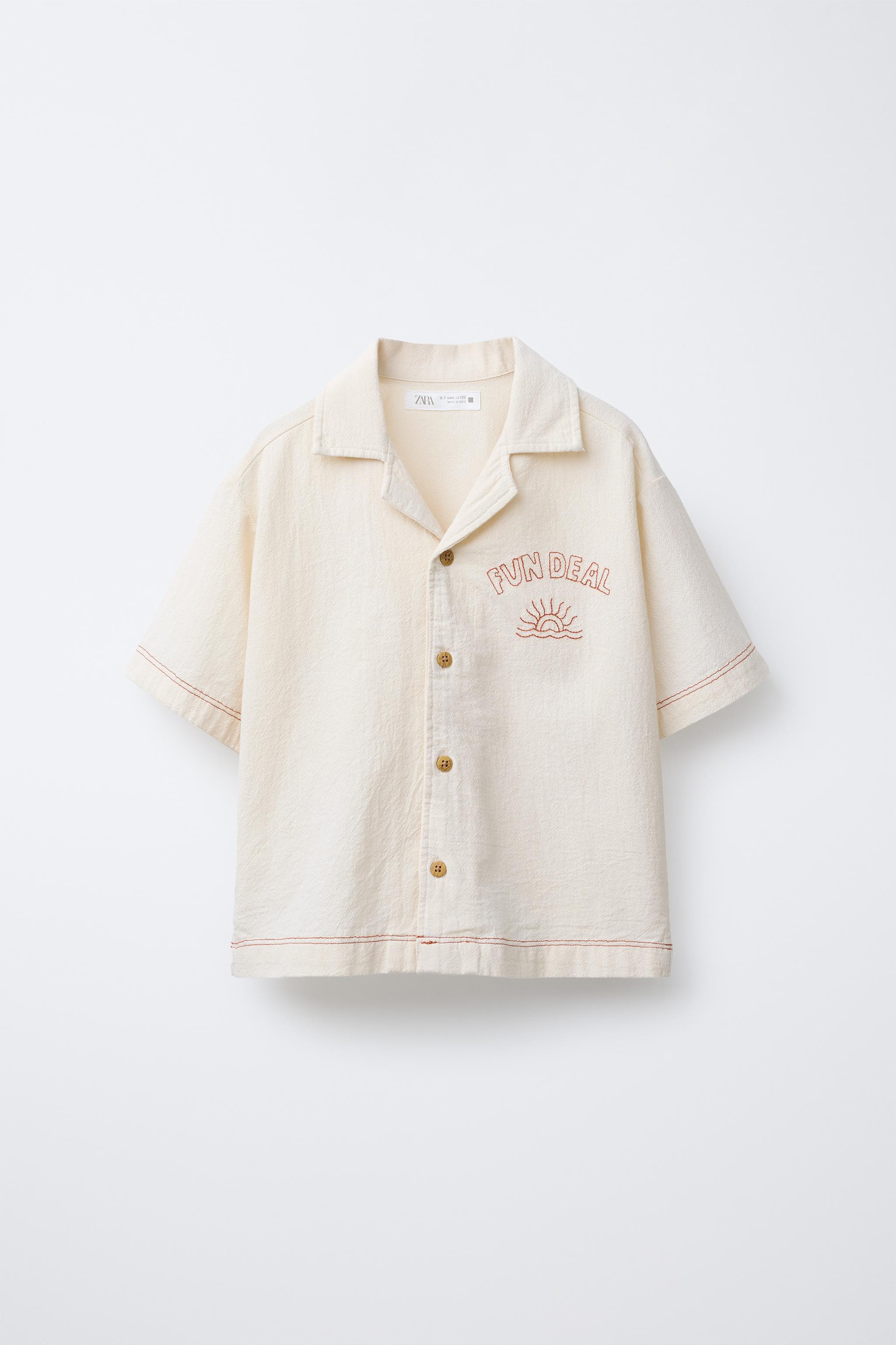 Shirt with spread collar and short sleeves. Front button closure. Embroidered detail on the chest... | Zara US