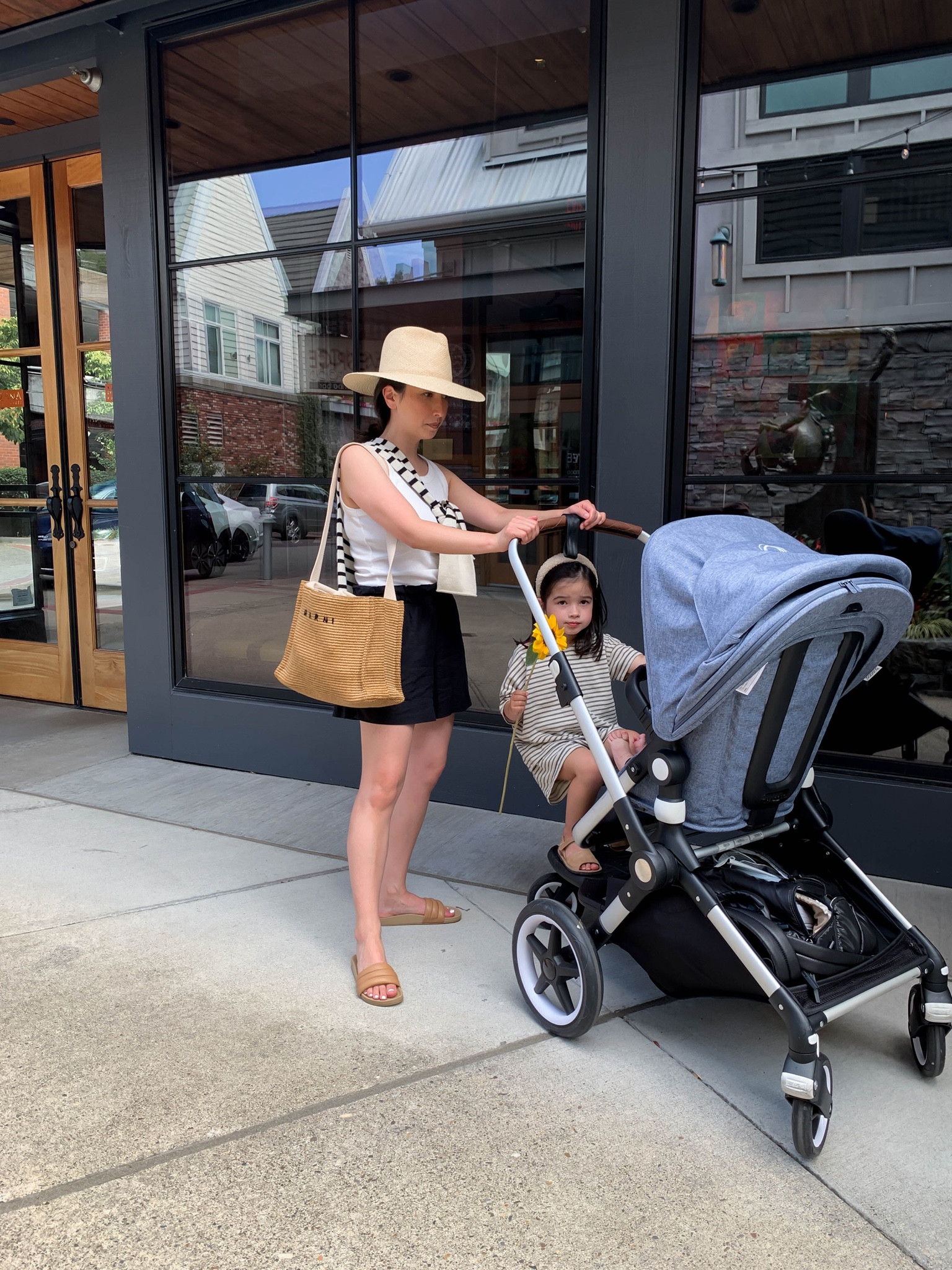 Mom on the go. Bugaboo Lynx stroller. 

Tank - Free Assembly small
Shorts - Gap petite xs
Slides - Beatrice Valenzuela 5
Bag - Marni
Hat - Janessa Leone small
