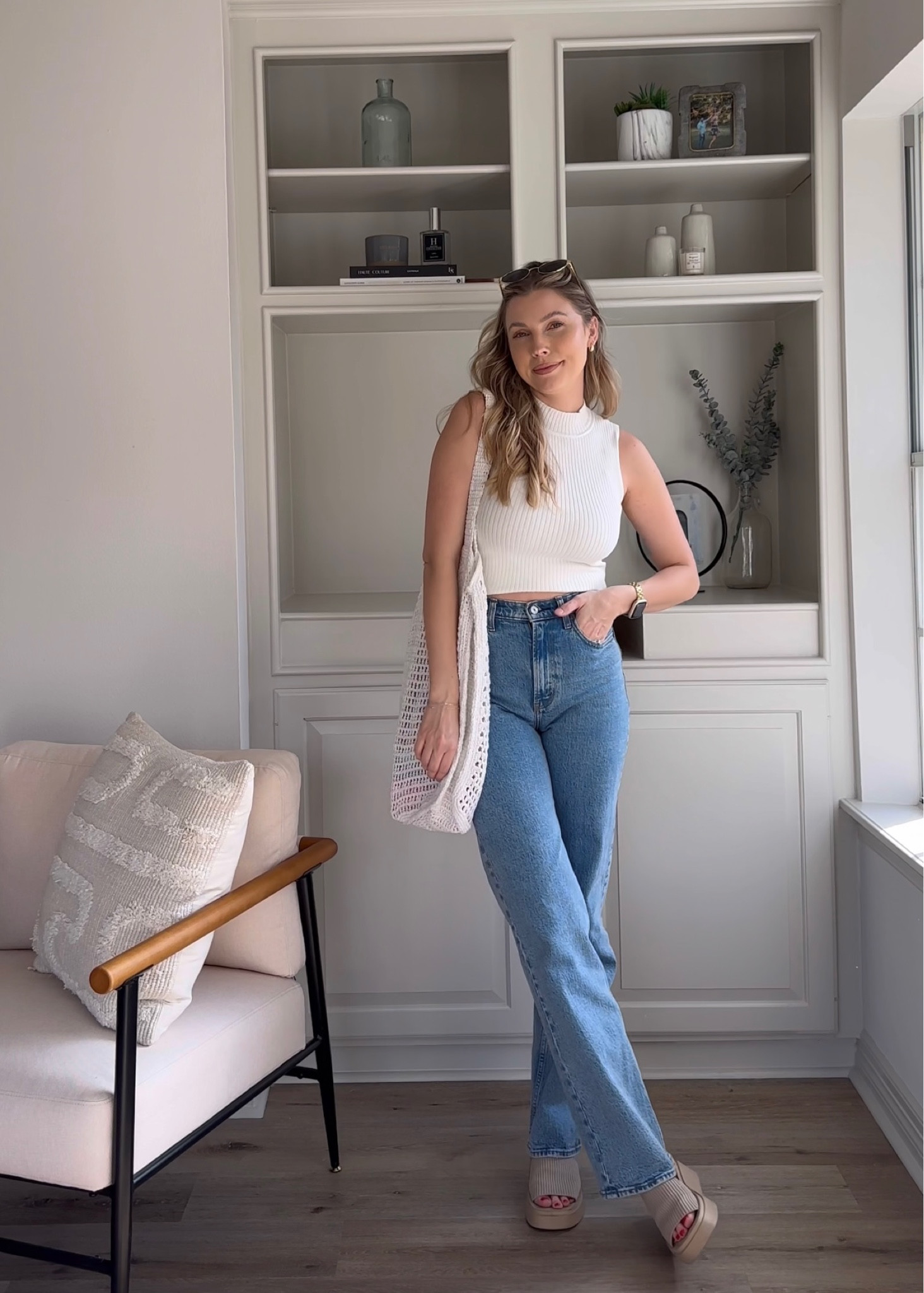 Casual spring outfit with a white mock neck sweater tank in M, and my favorite jeans in size 26L. Platform sandals true to size & similar tote bag.

#LTKSeasonal #LTKSpringSale #LTKstyletip