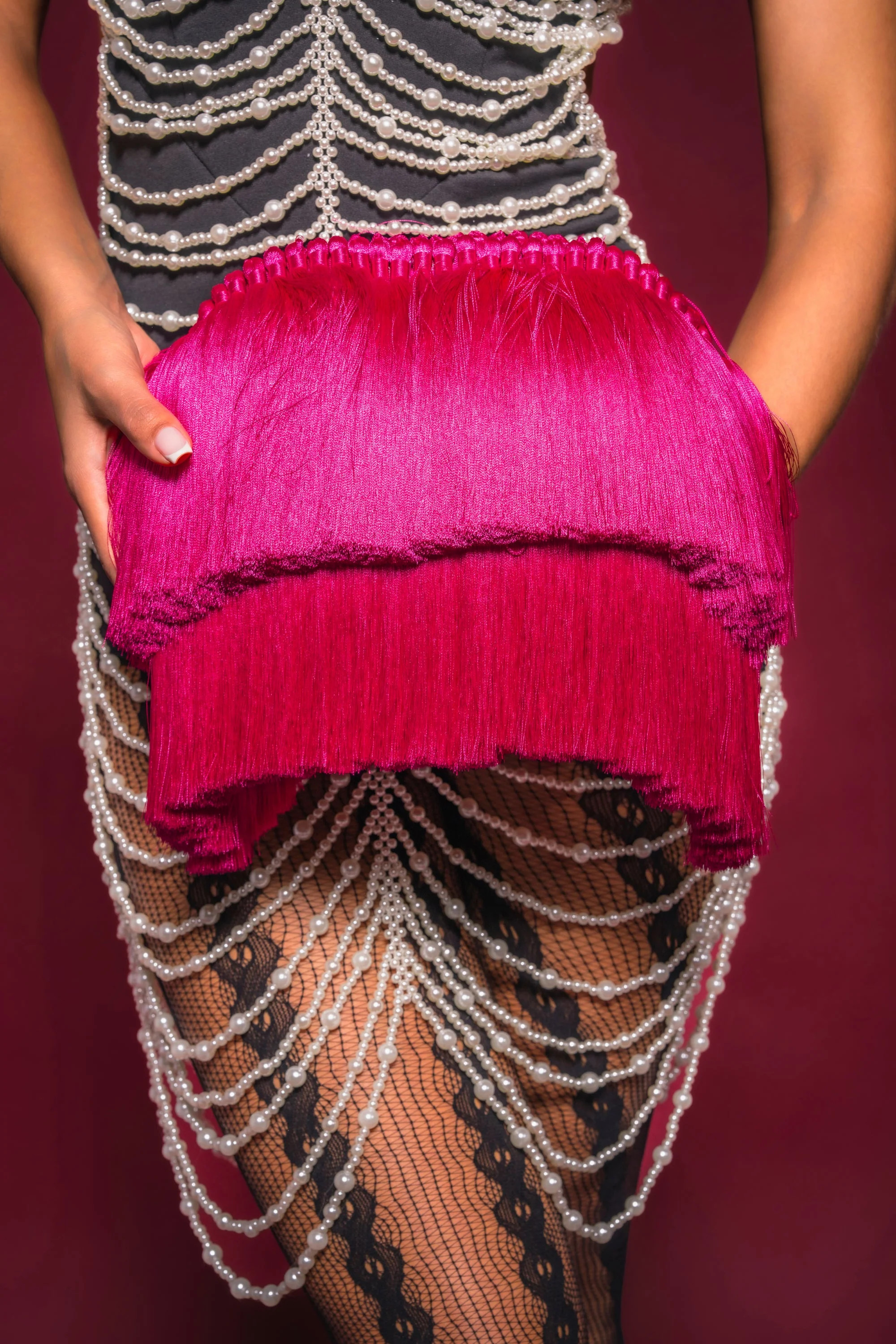 RAZZLE DAZZLE TASSEL CLUTCH | AKIRA