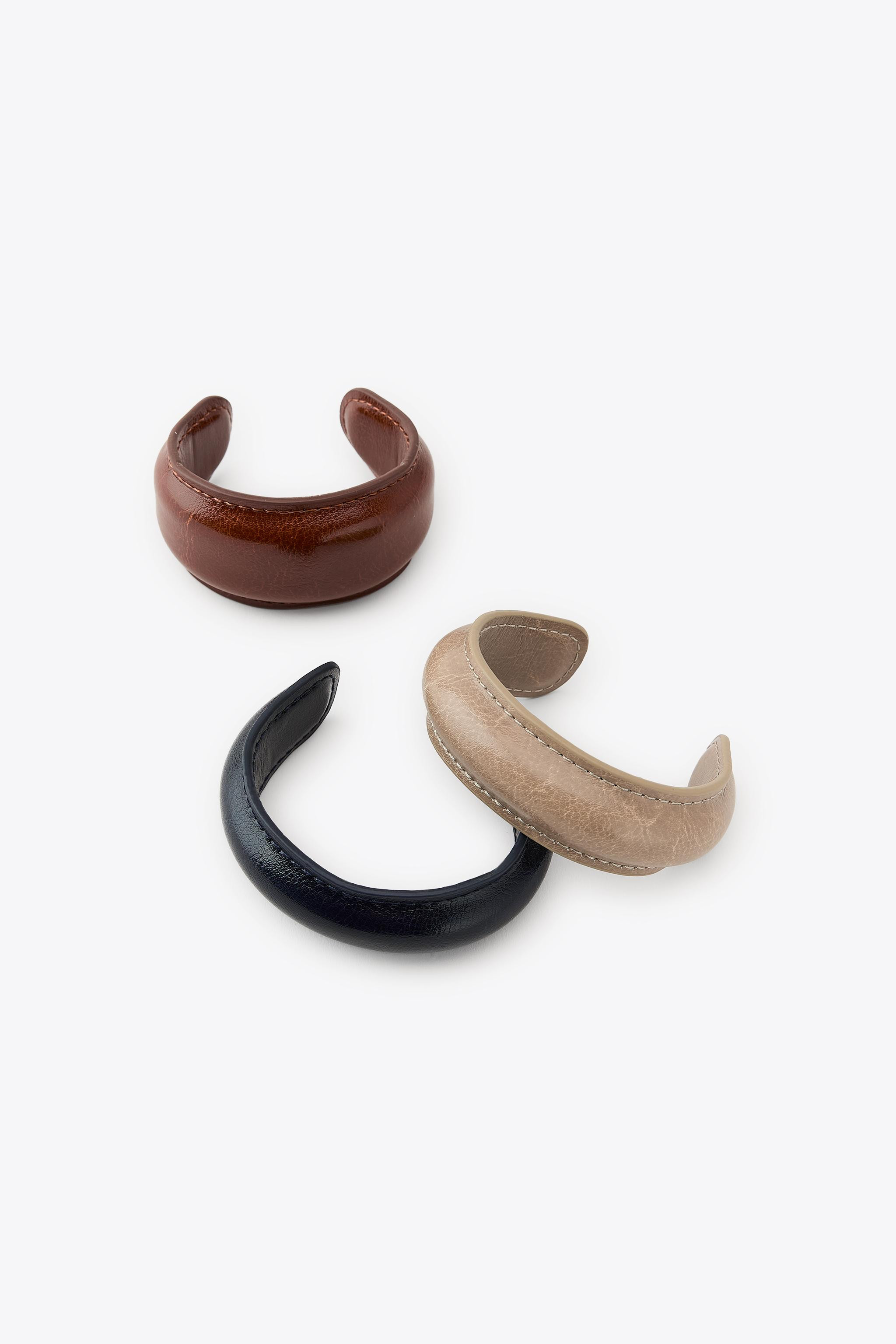 Pack of three rigid bracelets in different sizes, made of leather. | Zara US