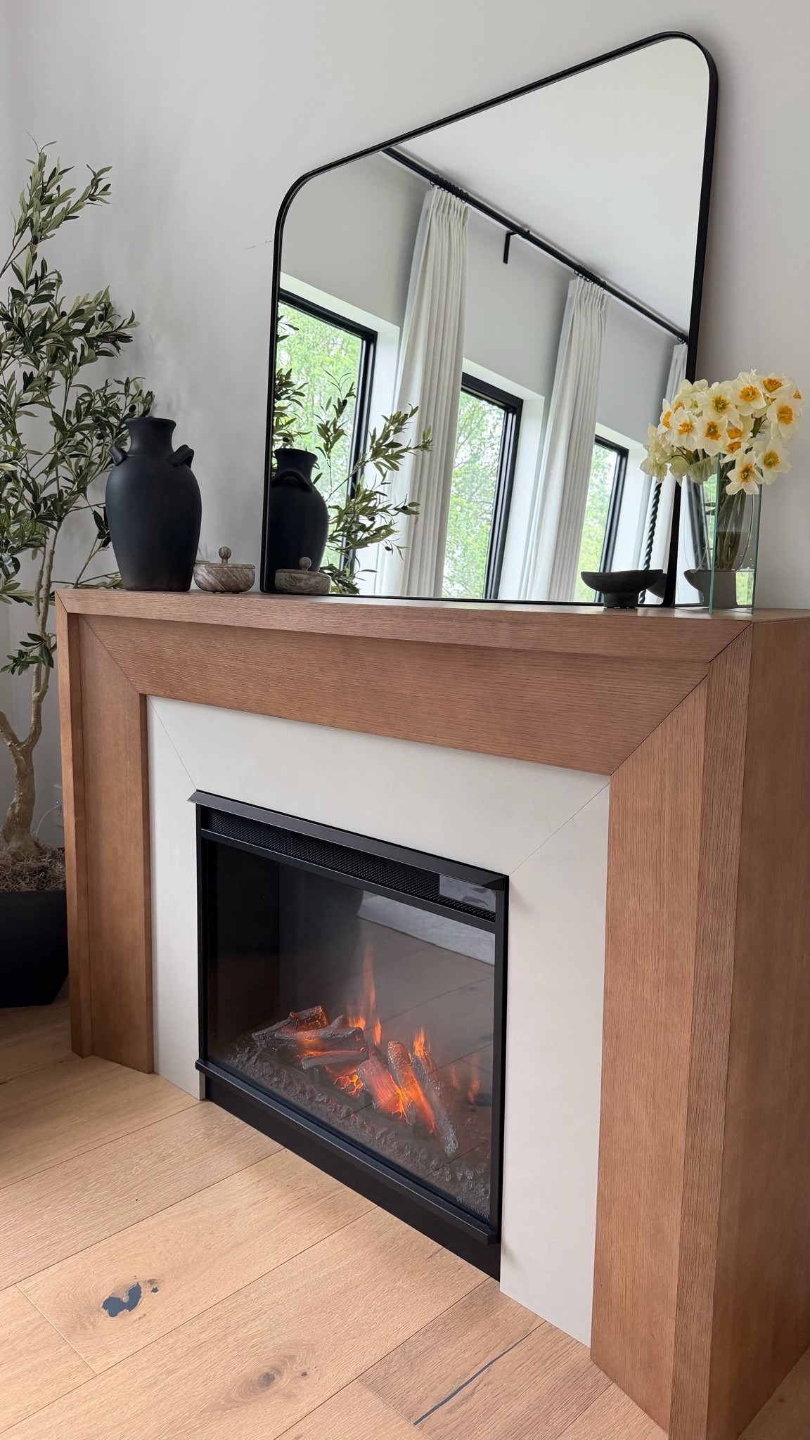 Raining day coziness ❤️
 
fireplace, mirror, bedroom, real flame, tree, vase, neutral, modern, home decor ￼

#LTKHome