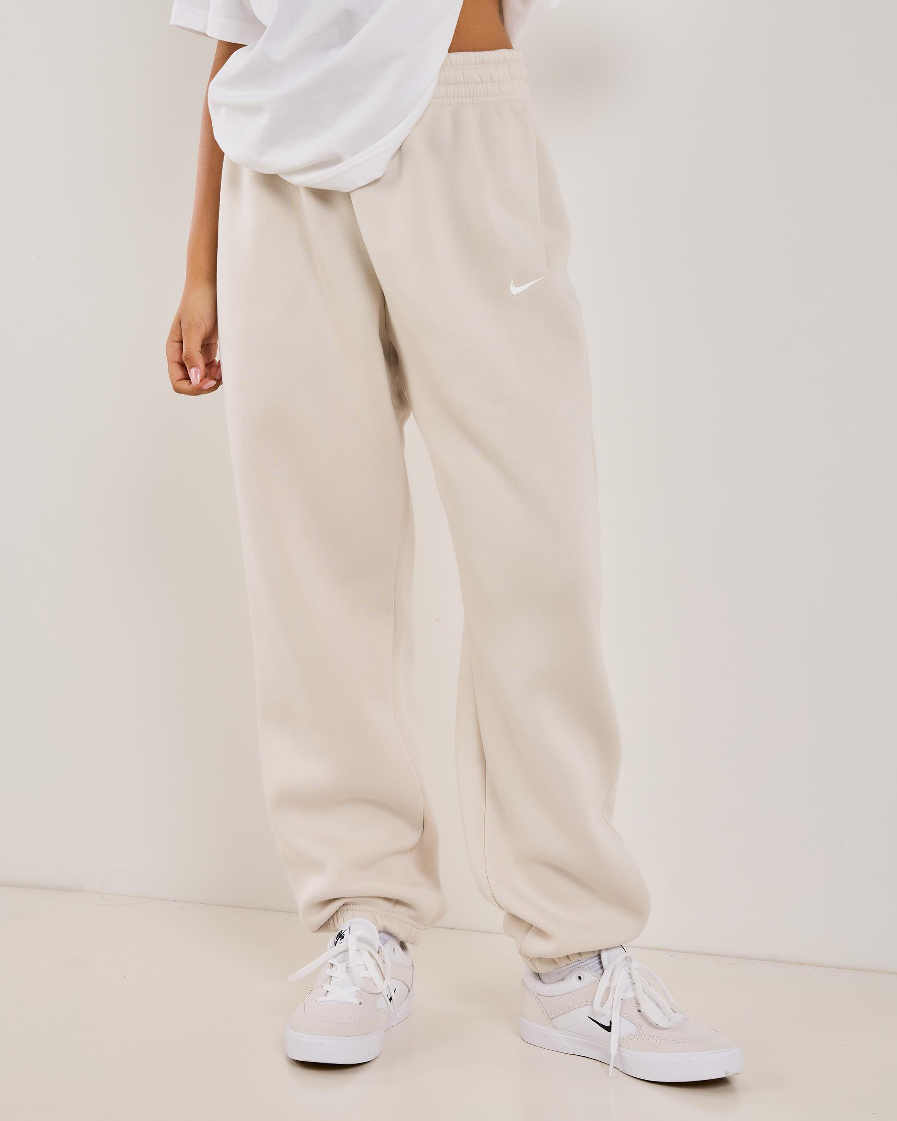 Nike Women's Phoenix High-Waisted Oversized Track Pants in Light Orewood Brown/Sail Size Small | City Beach (US)