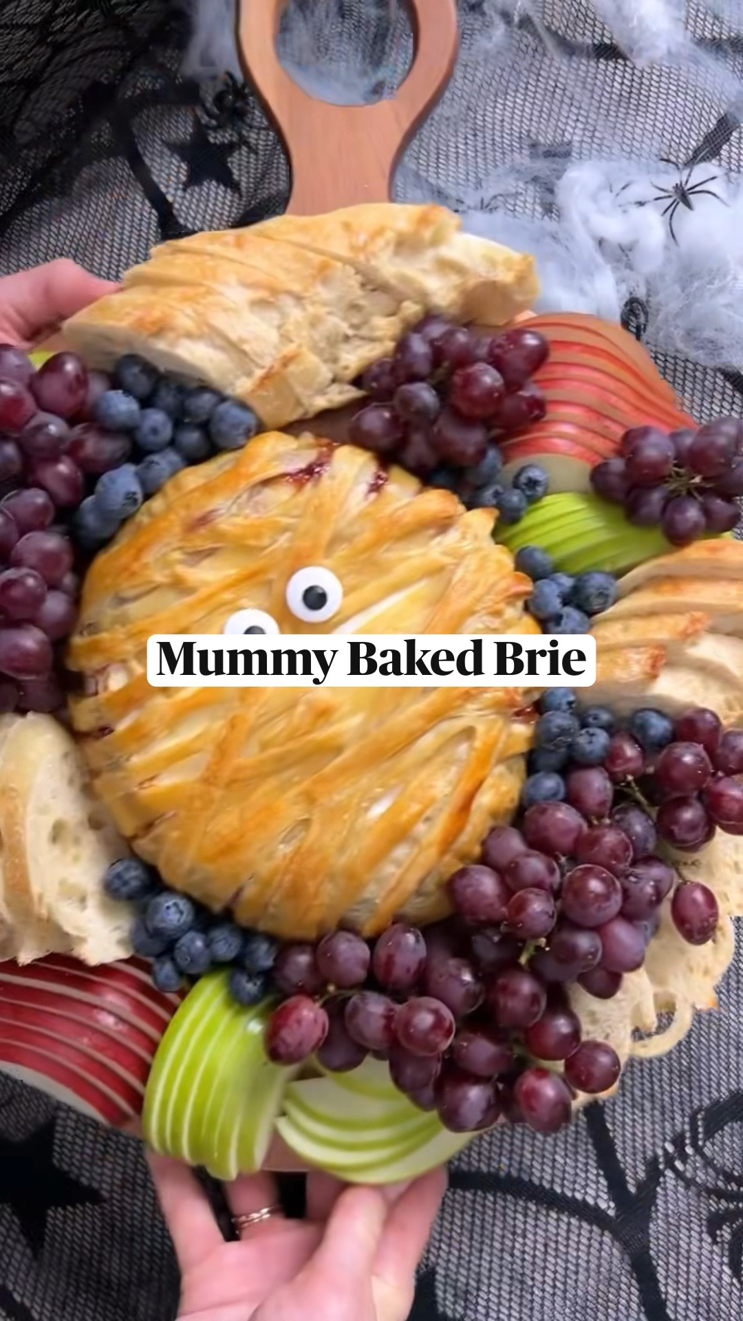 SAVE this MUMMY BAKED BRIE & make it for Halloween 🧻.

Full ingredients list on the blog. LINK IN BIO > find recipes on the blog > then scroll down.

DIRECTIONS:
Preheat the oven to 375°F. Line a baking sheet with parchment paper.

Slice of the top ½-inch of brie, and set aside. Spread the jam on the bottom piece of brie. Replace the top of the brie, covering the jam.

Roll the puff pastry out to approximately 14 x 11 inches. Place the brie in the center of the puff pastry. Make two cuts on both long sides of the dough, from the brie to the edges, to create even thirds. Fold the middle piece on each edge over the brie.

Cut ¾”-wide strips into the short sides of the dough, from the brie to the edges. Stretch the strips over top of the brie to create the mummy wrap. Transfer the brie to a parchment lined baking tray.

In a small bowl, whisk the egg with 1 teaspoon of water. Brush the egg wash all over the pastry. Bake for 20-25 minutes, or until the pastry is golden brown.

Add large edible eyes and serve warm with baguette, apples, pears, grapes, and blueberries, if using.

#ainttooproudtocheese #bakedbrie #halloweenfood #feedfeed #thatcheeseplate #food52 #imsomartha

#LTKHoliday #LTKhome #LTKSeasonal