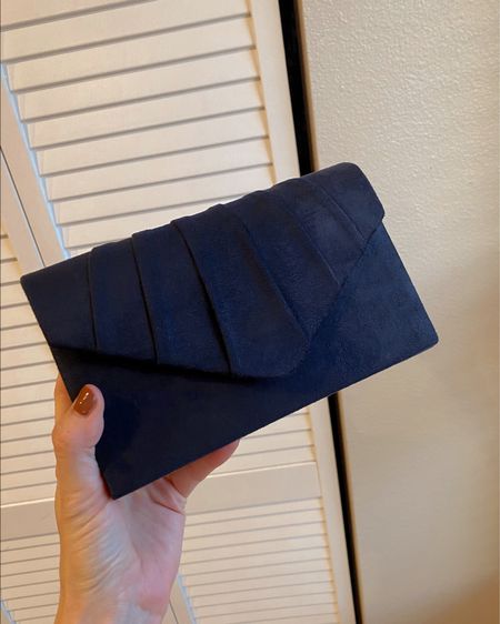 Navy evening clutch. You can wear it with the strap or you can hide the strap inside. 

Looks nice in person. 

#eveningclutch #weddingguest #bag #weddingguestbag

#LTKwedding #LTKSeasonal #LTKitbag