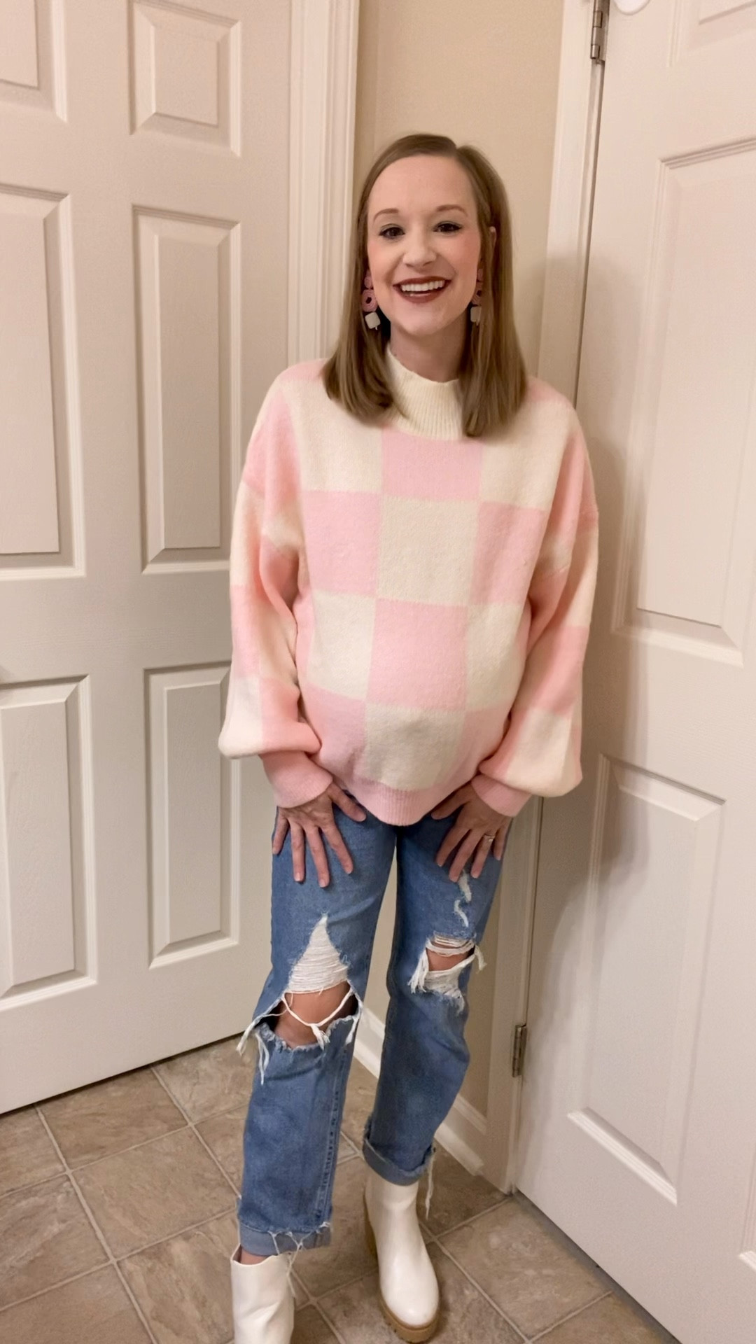 Outfit of the day! 🤍 Wanted to share this adorable checkered pink and cream sweater with you from Shein! It is so cozy and cute and is perfect for the winter season but also transitions to the Spring too!! I paired with with some ripped jeans and my off white Chelsea lug boots from Walmart! You can shop my entire outfit my clicking the link below or watching my stories! 💕 

#LTKshoecrush #LTKstyletip