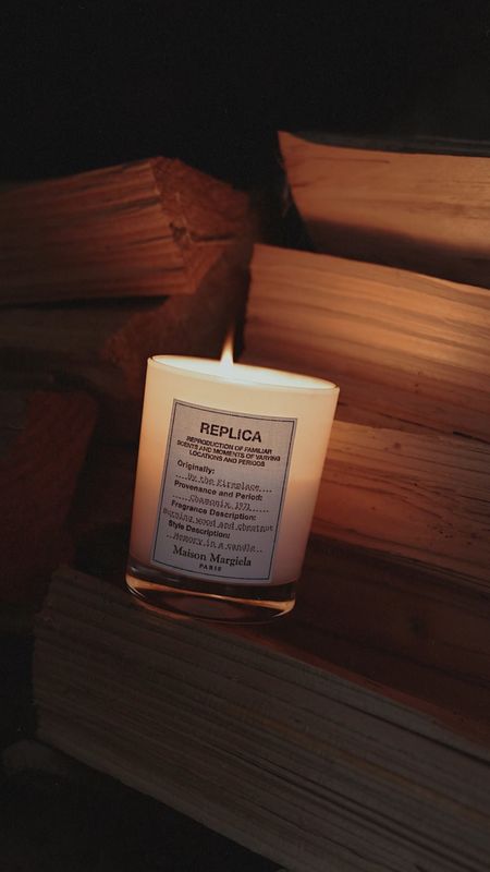 A warm, yet spicy scent that recreates the sweetness of curling up by a fireplace – surrounded by the sound of crackling wood with a frosty landscape outside your window. With a perfectly balanced fusion of Clove Oil, Chestnut and Vanilla, this luxury candle warms any room in your home with its smoky, woody aroma.

Maison Margiela 'REPLICA' By The Fireplace Scented Candle

#LTKhome #LTKSeasonal #LTKGiftGuide