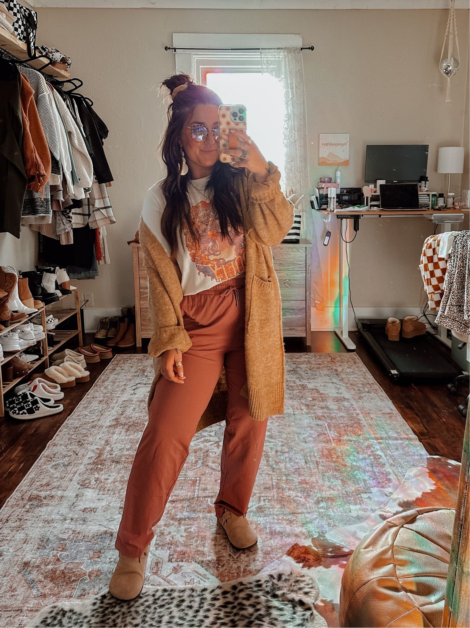 Boho way to style and wear sweatpants and oversized graphic tee. Wearinng medium in dolly tee for oversized tee. Medium in sweatpants. TTS in clogs. Small oversized chunky cardigan. 

#LTKHolidaySale #LTKU #LTKSeasonal