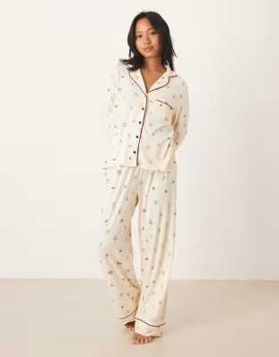 ASOS DESIGN Petite super soft long sleeve shirt & trouser pyjama set with contrast piping in Chri... | ASOS (Global)